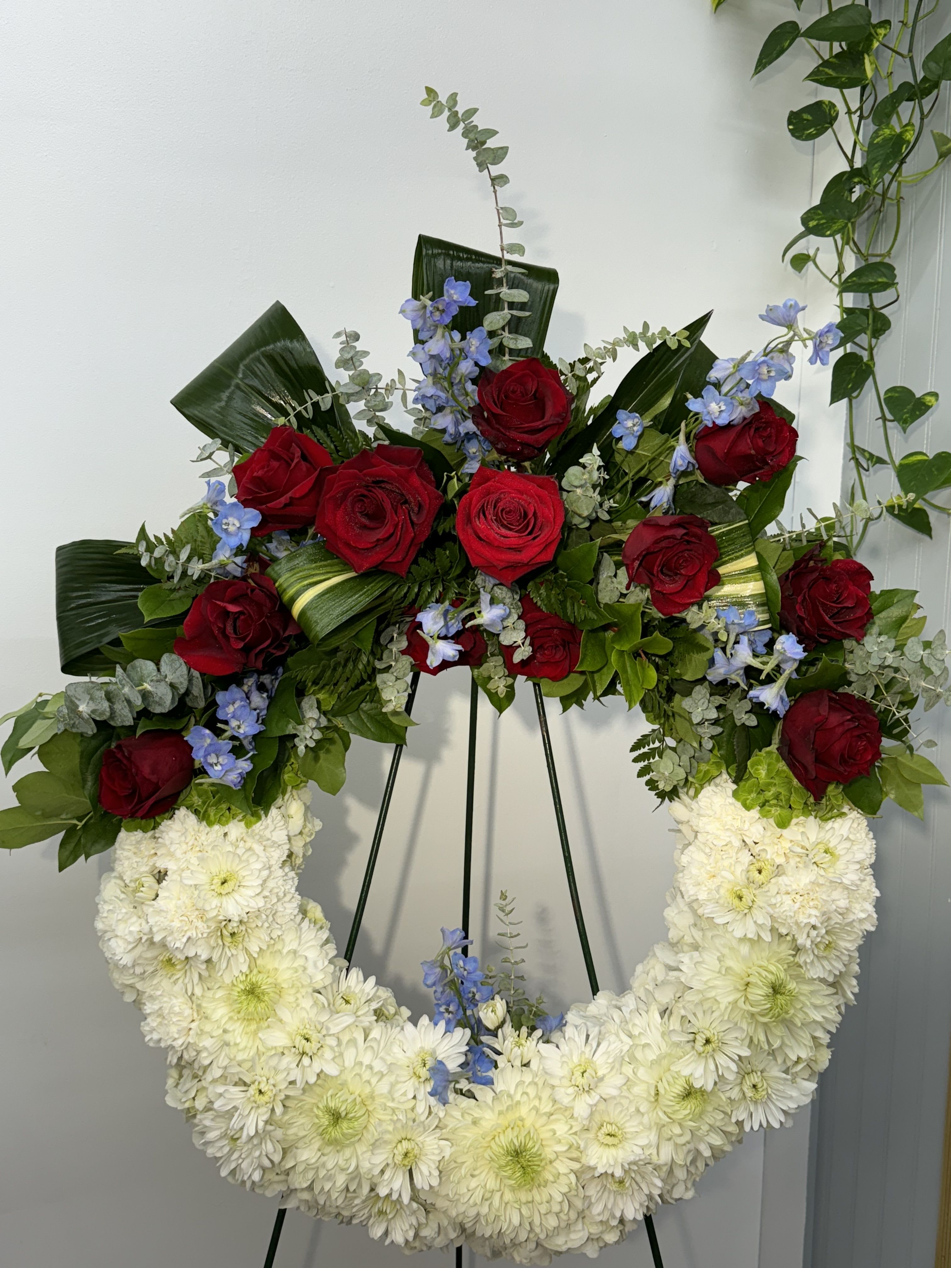 Red American Soul by  Jolys Florist - A perfect way to honor their beliefs and actions, this red, white, and blue wreath is a tribute to those who loved their country. 