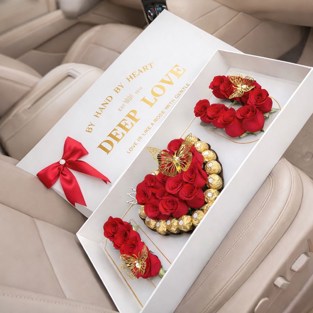 Just Because, I LOVE YOU - A breathtaking luxury presentation spelling LOVE with premium red roses, centered by a heart-shaped arrangement surrounded by decadent Ferrero Rocher chocolates. Designed inside a refined keepsake box with gold accents, LOVE, Always is a grand declaration of romance and devotion.