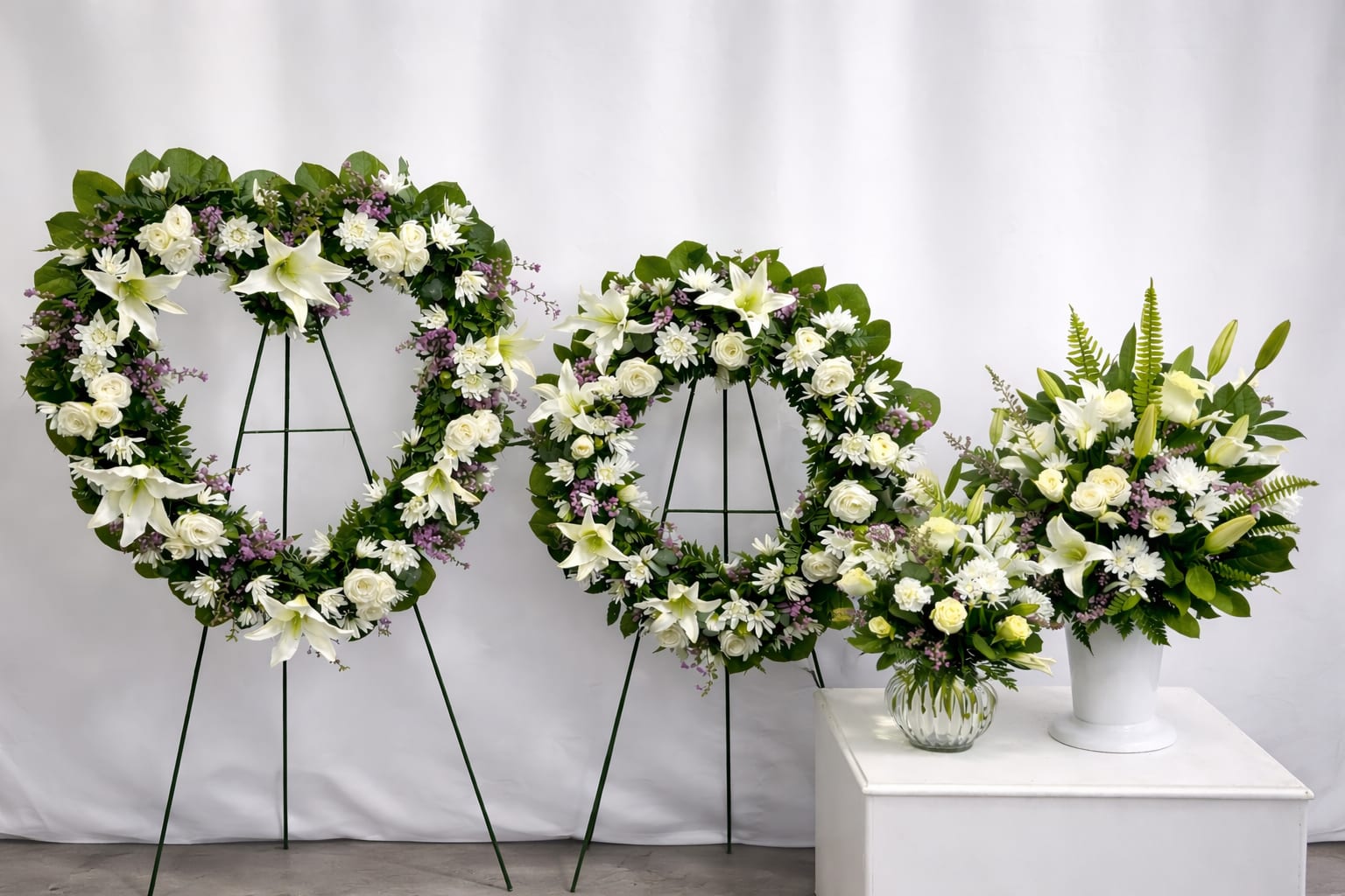 Lily Rose Tribute - The traditional arrangements of this sympathy set are meant for celebrating the life of a loved one at a visitation, funeral, church service, cremation, or cemetery service – or as a delivery to the family's home.