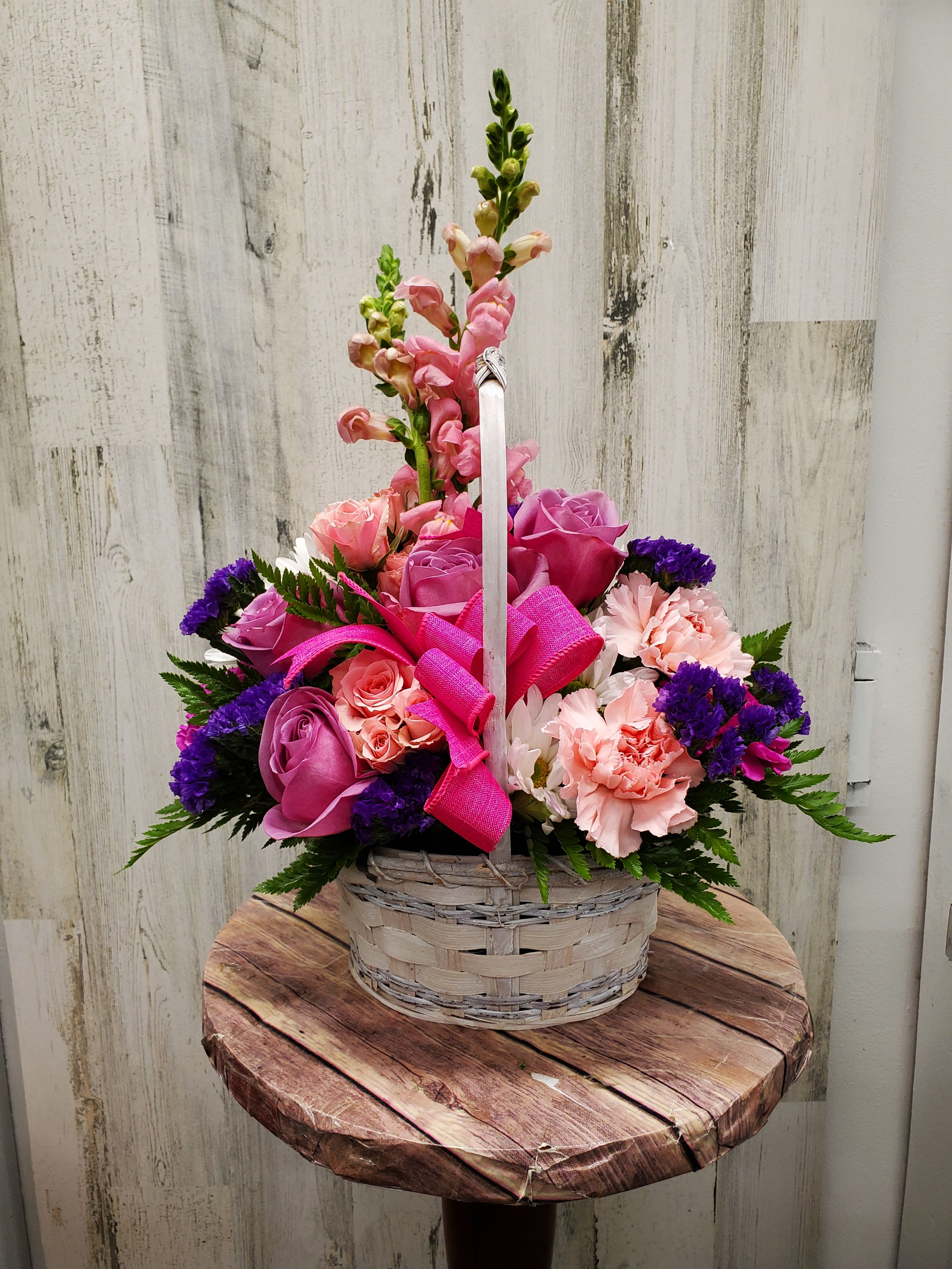 Rosetta  - This White basket with Pink and Purple flowers is great for any occasion.  