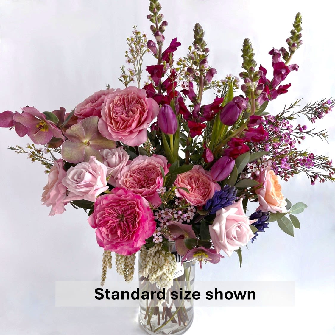 International Women's Day Bouquet - Celebrate strength, beauty, and resilience with this lush arrangement of rich pinks, deep purples, and soft blush tones. Featuring garden roses, snapdragons, and delicate accents, this bouquet is a vibrant tribute to the women who inspire us. Designed to make a bold statement, it’s perfect for honoring the powerful women in your life. 