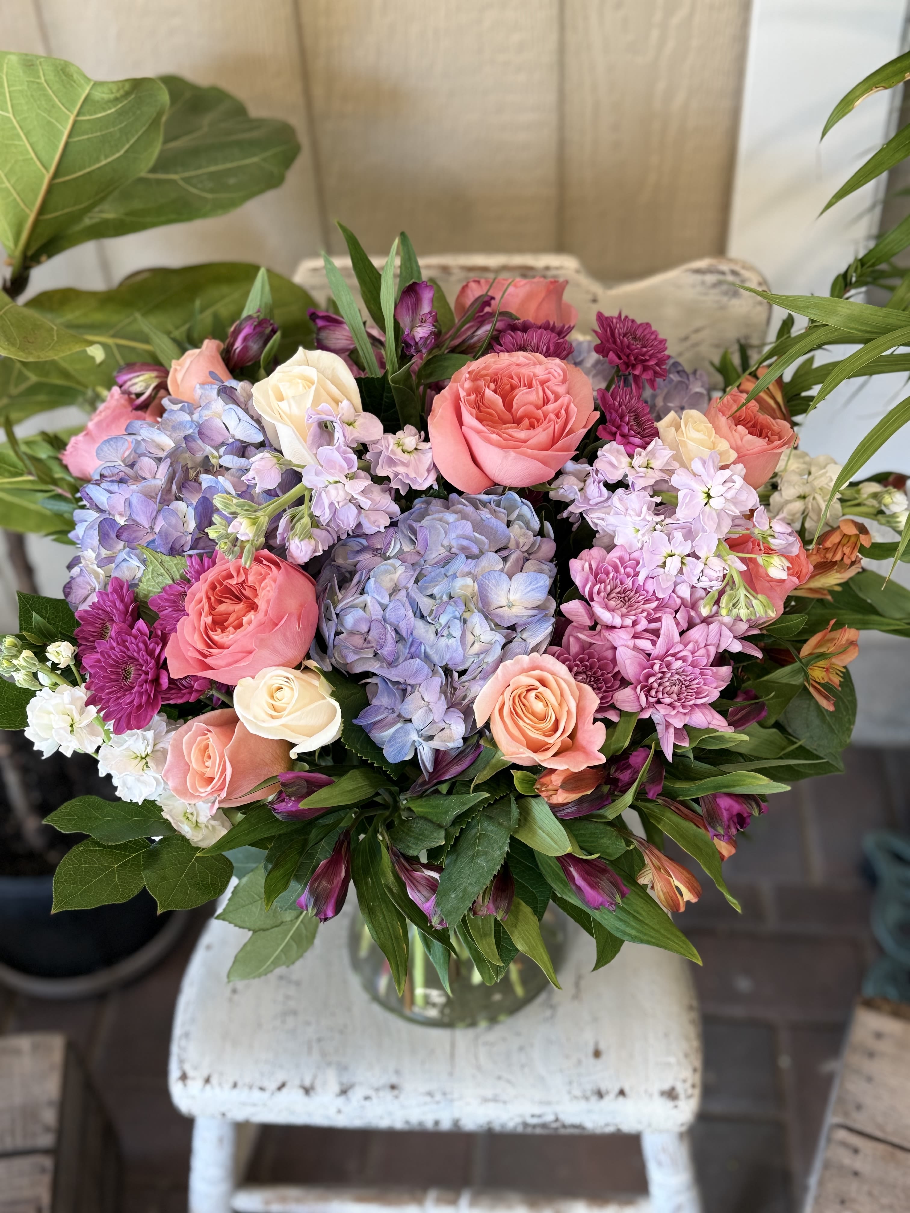 Pastel Dreams - Enjoy a beautiful arrangement of roses and hydrangeas in a soft range of color.