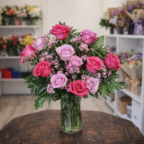 Hot Pink/Lavender Roses - Dozen roses arrangement on sale now.  Ready in the cooler for fast delivery or pick up