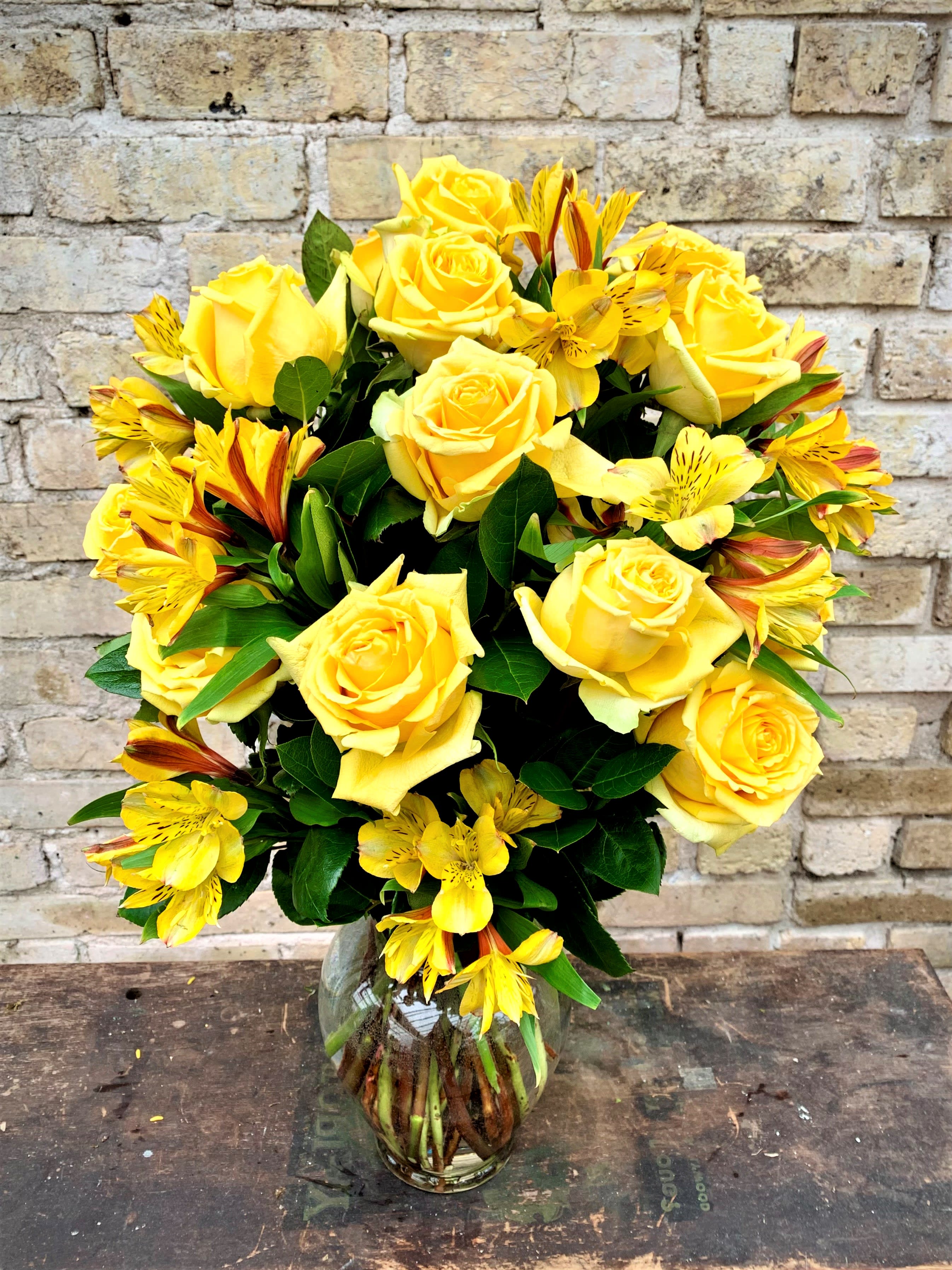 Sunsprite with Filler - A Beautiful Dozen Yellow Roses With Alstroemeria.  Filler Flower May Vary Depending on Availability.