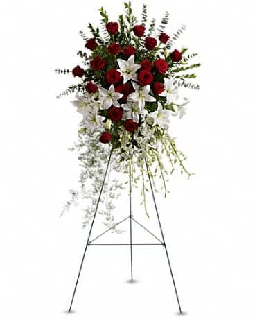 Lily and Rose Tribute Spray - Pure white lilies and dendrobium orchids mingle with red roses, white asiatic lilies and more in this magnificent and impressive standing spray of the finest blooms. A fitting tribute for a funeral, wake or memorial service. A standing spray of lush flowers such as red roses, white dendrobium orchids and asiatic lilies - accented with greenery - is delivered on an easel.Approximately 31" W x 50" H