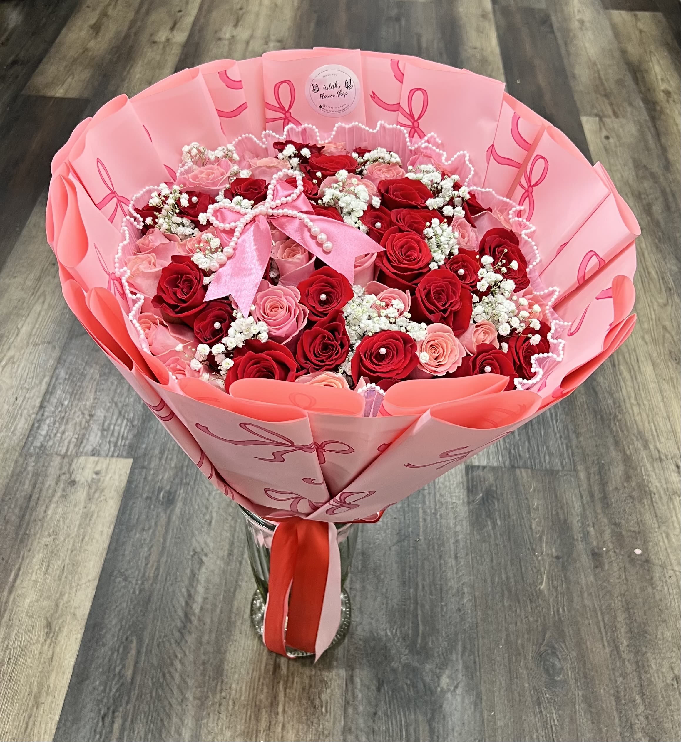 50 Red And Pink Roses Bouquet With Baby’s Breath Between The Roses - Buyer will receive 50 Roses in total.