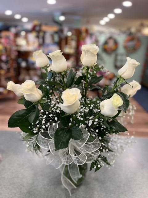 Bouquet of white roses with baby's breath and a sheer ribbon