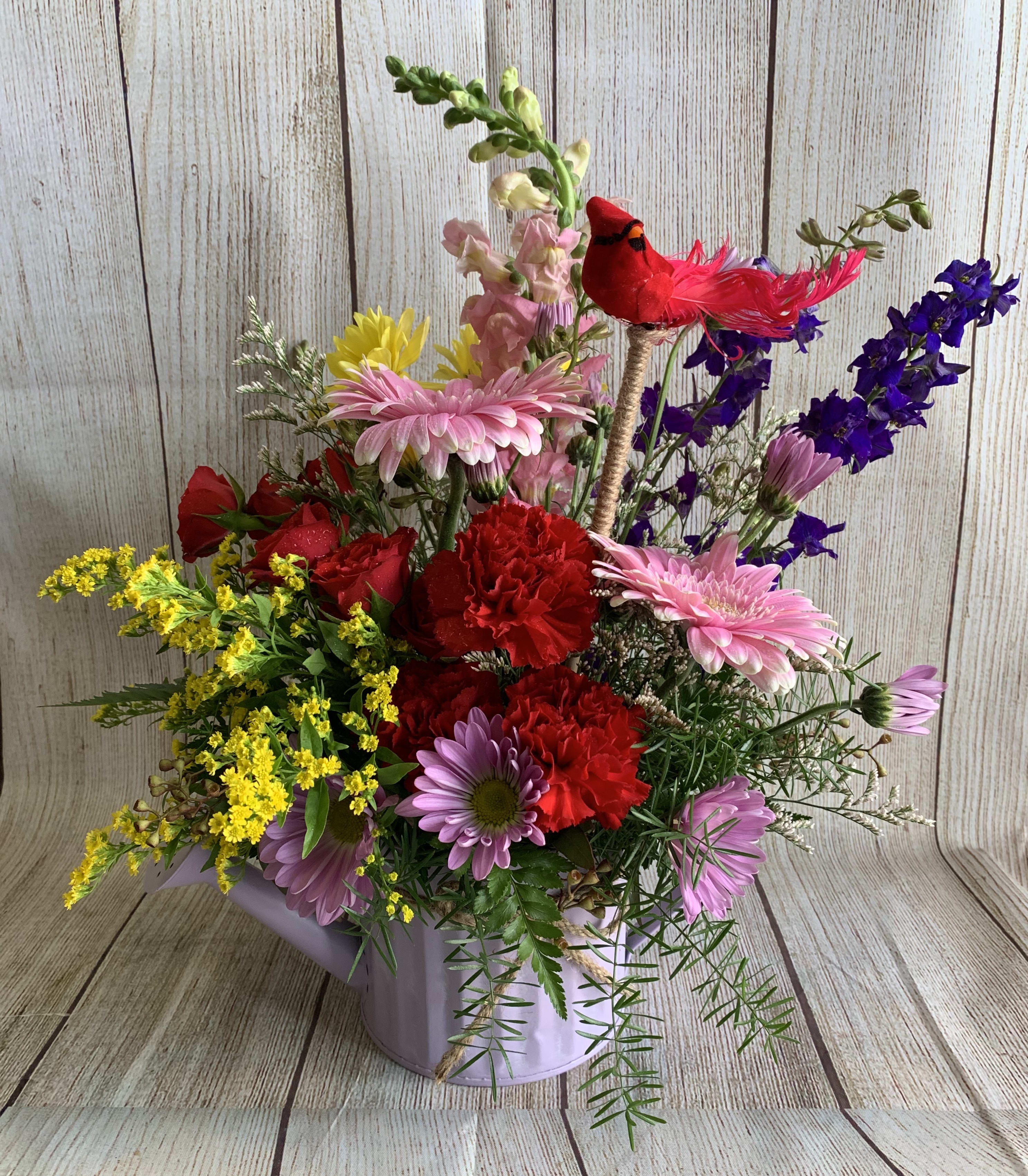 Flower Shower - Spring flowers in a keepsake watering can. A Flower shower! Even the little cardinal couldn't resist a perch. (Flower colors &amp; container may vary in order for each one to be unique. All designs are arranged as similar as possible. We promise to keep the same color, style, and overall theme with what Mother Nature generously blesses us with)