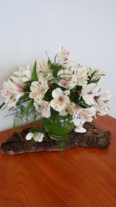 "Thinking of her" bouquet - Thinking of her bouquet is a heartfelt way to let someone know they’re on your mind. This charming bouquet features delicate white alstroemeria, a bloom symbolizing care, friendship, and devotion.   This bouquet’s compact size makes it a versatile option for small spaces. Whether adorning a work desk, nightstand, or cozy living room corner, its elegant simplicity fits seamlessly into any environment.   Looking for birthday flowers that are as special as the recipient? Thinking of her bouquet is a wonderful way to say, “You matter.” Its light and airy presence brings cheer to birthdays while showing your appreciation for a loved one or friend. For those needing a pick-me-up, this bouquet’s gentle blooms are an uplifting choice for get-well flowers. Their enduring beauty symbolizes hope and resilience, sending a message of encouragement and care.  We understand that life moves fast, and sometimes you need flowers delivered at a moment’s notice. That’s why we offer same-day delivery in Olympia, WA, as well as Tumwater, WA, and Lacey, WA. Our reliable delivery service extends to surrounding areas, ensuring your thoughtful gesture arrives promptly. Whether surprising a friend at home or sending a little joy to a colleague’s office, we make it easy to share smiles and brighten days.  Please note colors may vary due to availability         