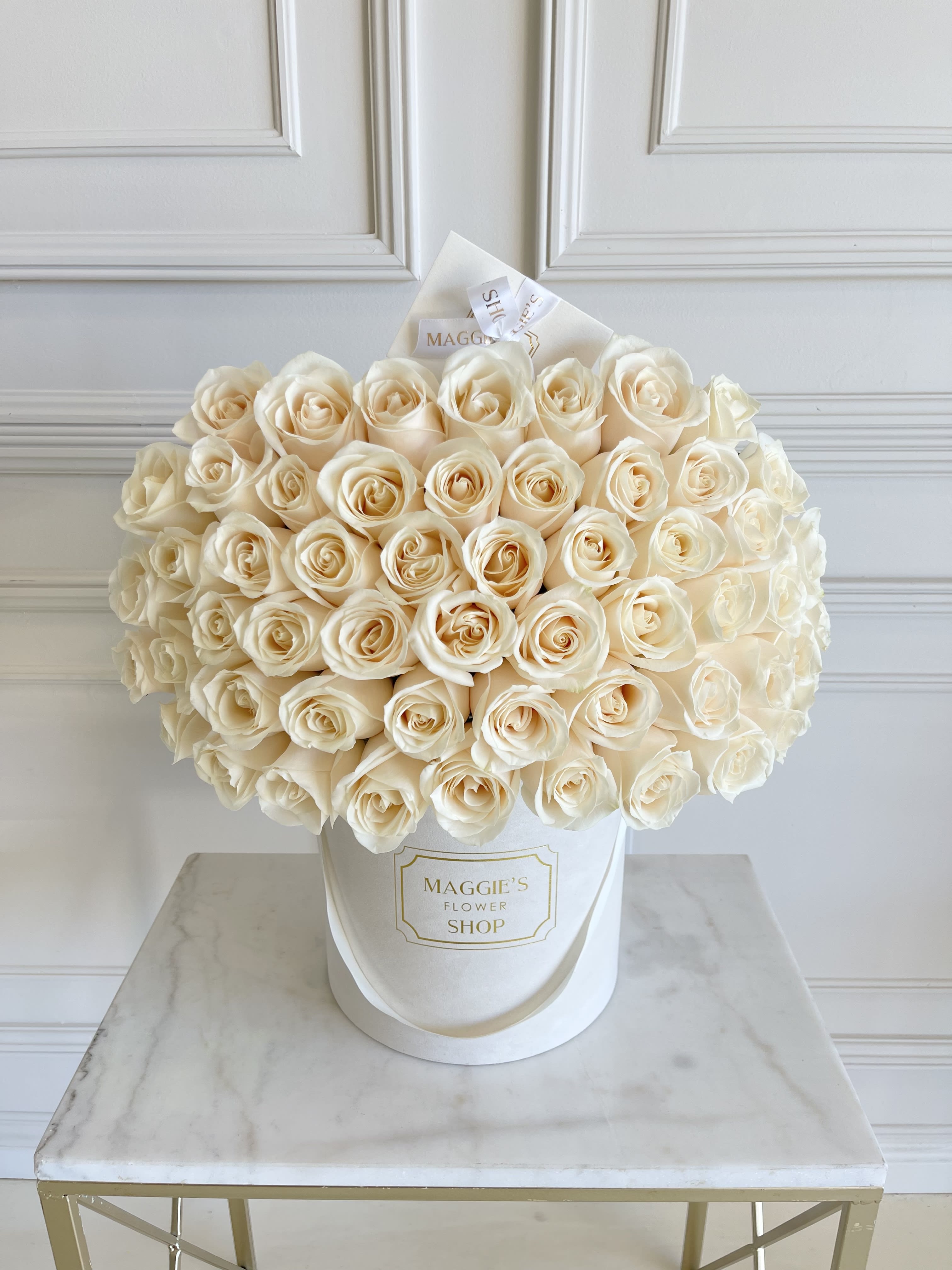 MFS 50 White Rose Box  - MFS Signature Suede 50 Rose Box    *Our signature beige suede box is currently out of stock   Black suede box and grey suede boxes are available. Under florist instructions (during the checkout process) let us know which color box you would prefer.