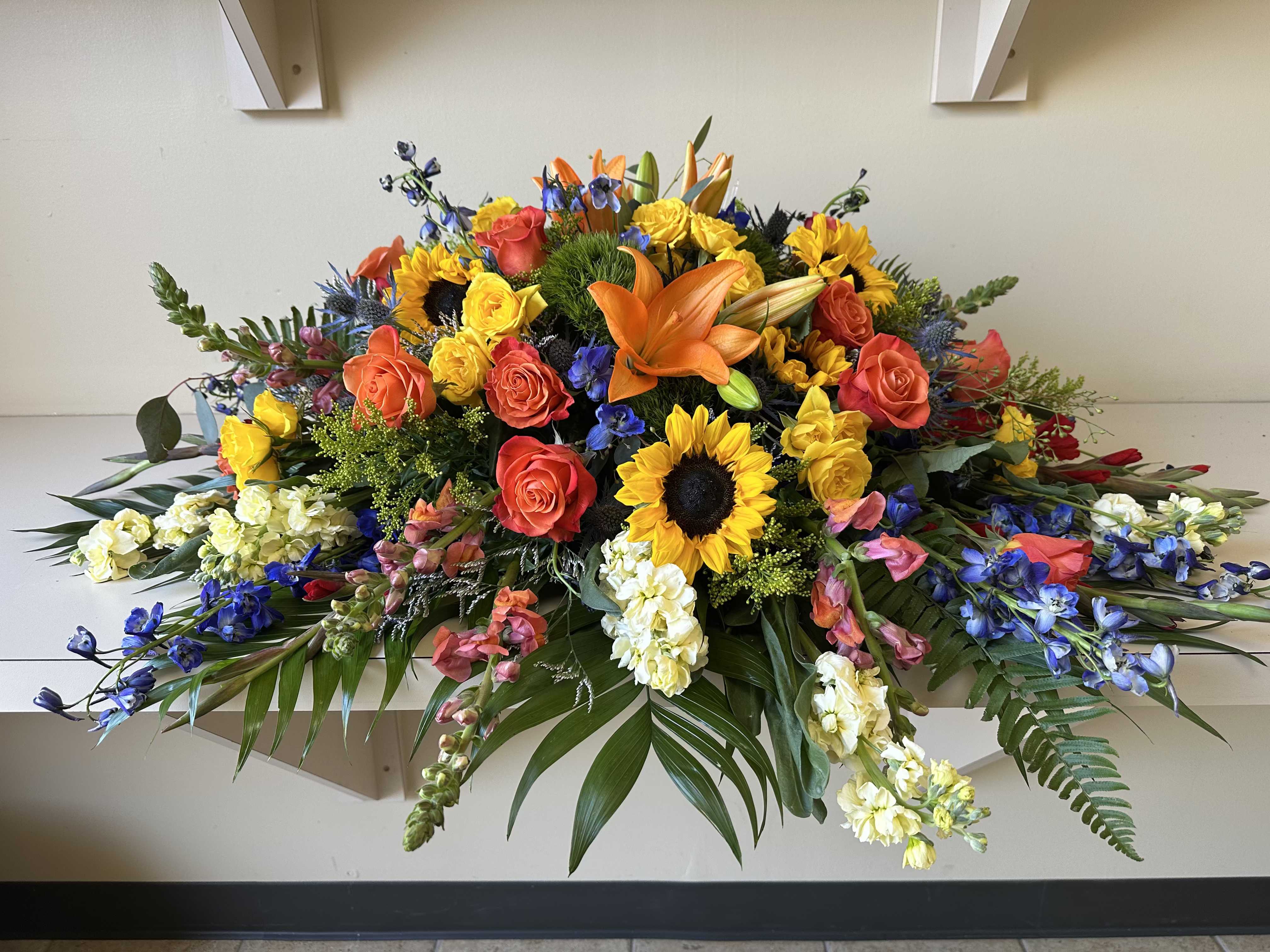 Colors of the Rainbow Casket Cover - Casket Cover will approximately match this -- color and flower substitutions may be needed