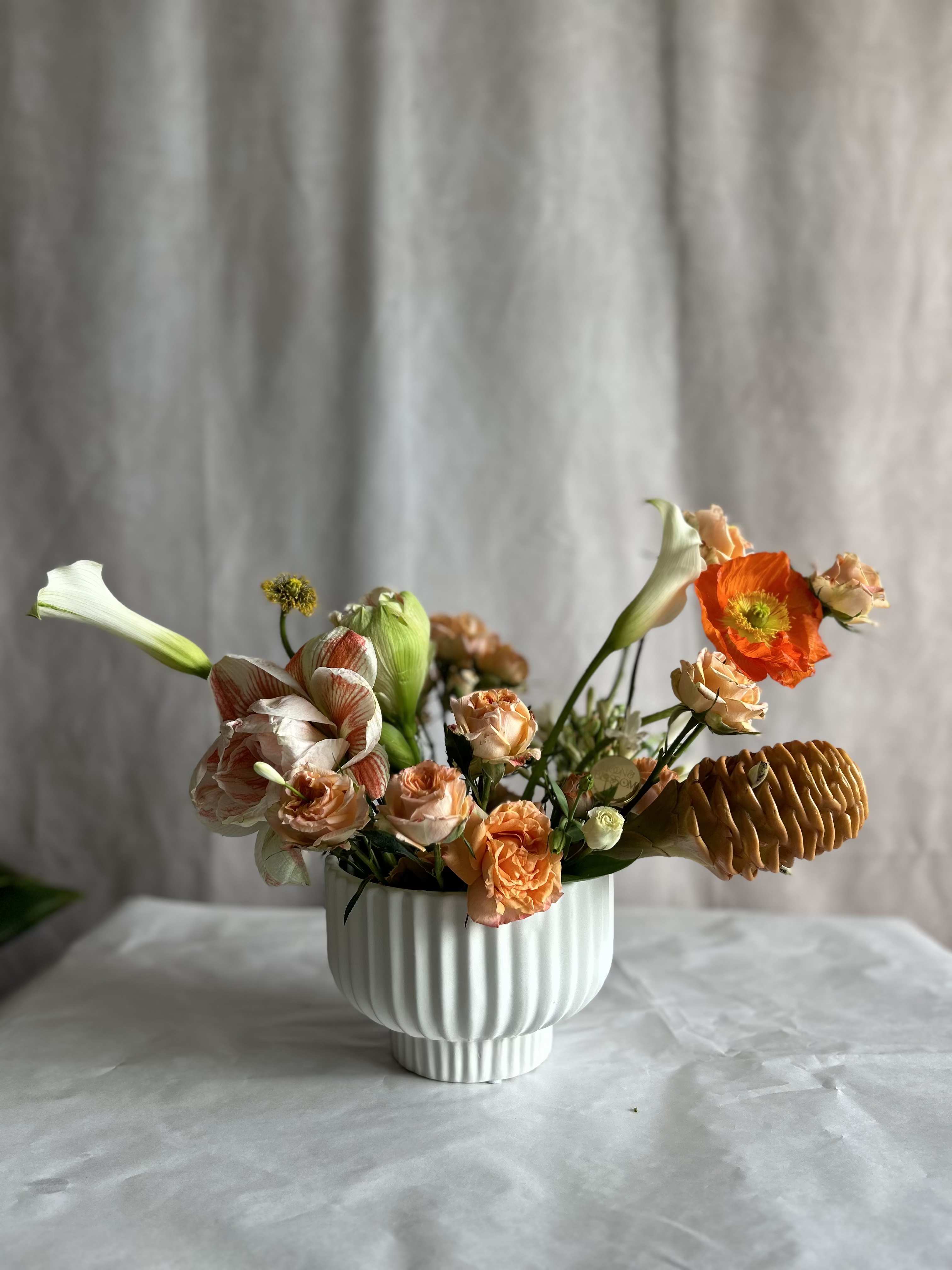 Ginger party - Ginger, poppies, amaryllis, roses and lillies If orange is your vibe, this is your arrangement! It is striking and unique