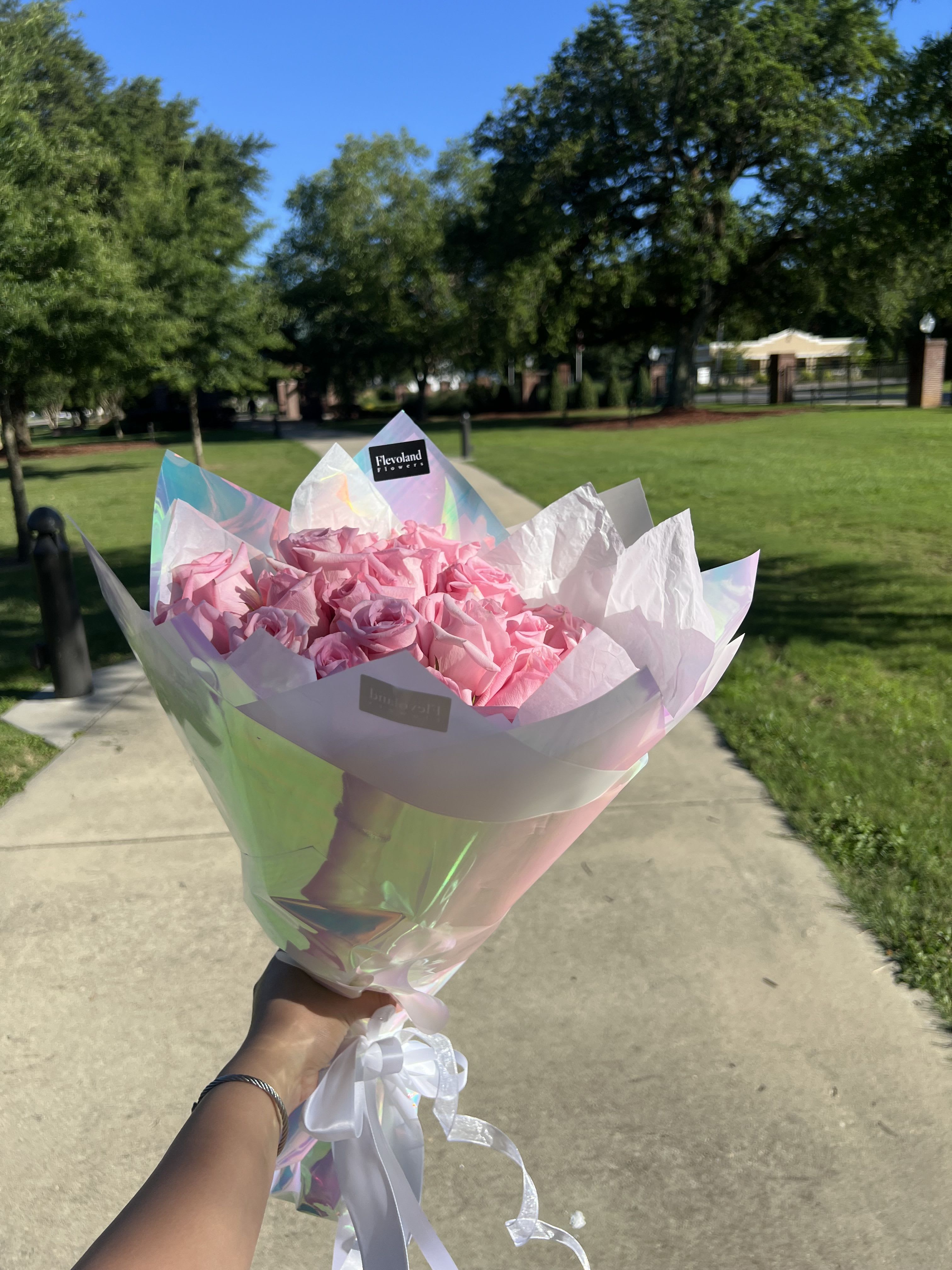 Classic pink roses  - A timeless bouquet of classic pink roses, elegantly wrapped in paper to preserve their natural beauty. Perfect for expressing love, appreciation, or simply brightening someone’s day with soft, feminine charm.