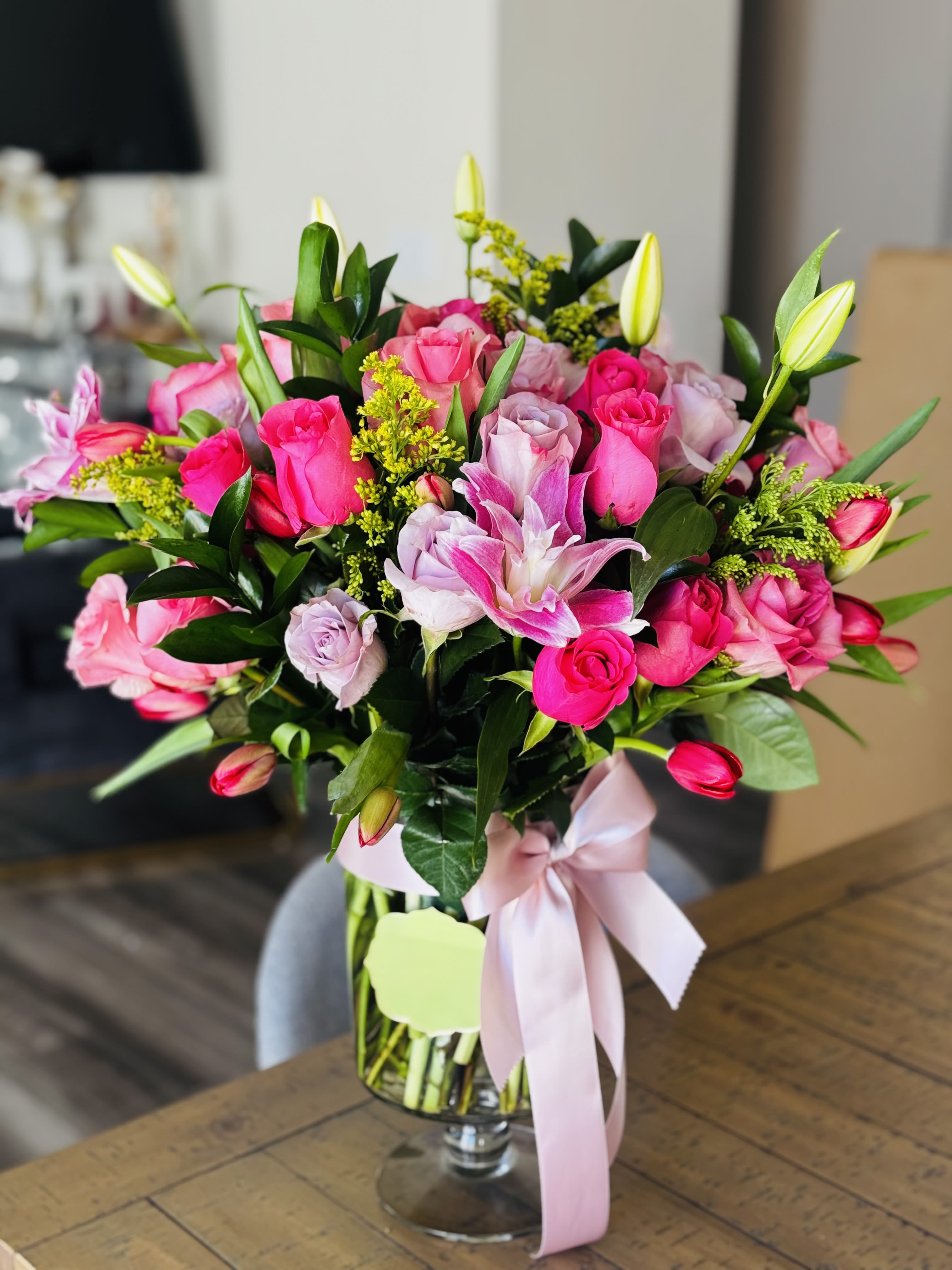 Love in pink Crystal arrangement  - Beautiful glass vase with roses, lilys, solidago, tulips and others greenery.