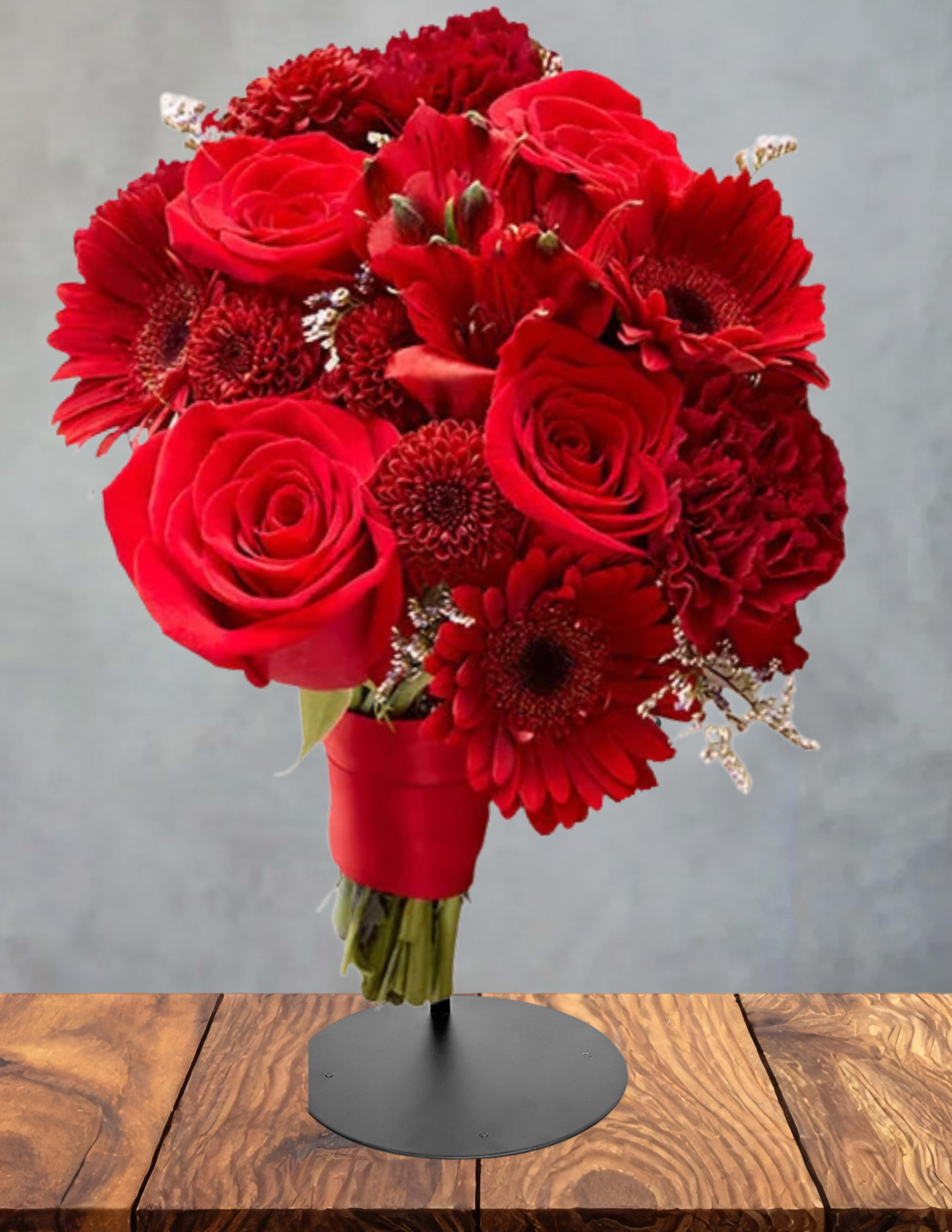 Red prom boquet  - A prom bouquet is a hand‑tied collection of fresh, premium blooms designed to elevate any formal look. Each bouquet is crafted with balanced color, soft movement, and thoughtful texture, creating a polished accessory that photographs beautifully from every angle. Lightweight and comfortable to hold, it adds a touch of elegance to grand entrances, portraits, and the entire evening. Finished with coordinated ribbon and subtle greenery, this bouquet complements any dress or suit style—classic, modern, romantic, or bold—making it a timeless choice for an unforgettable night.