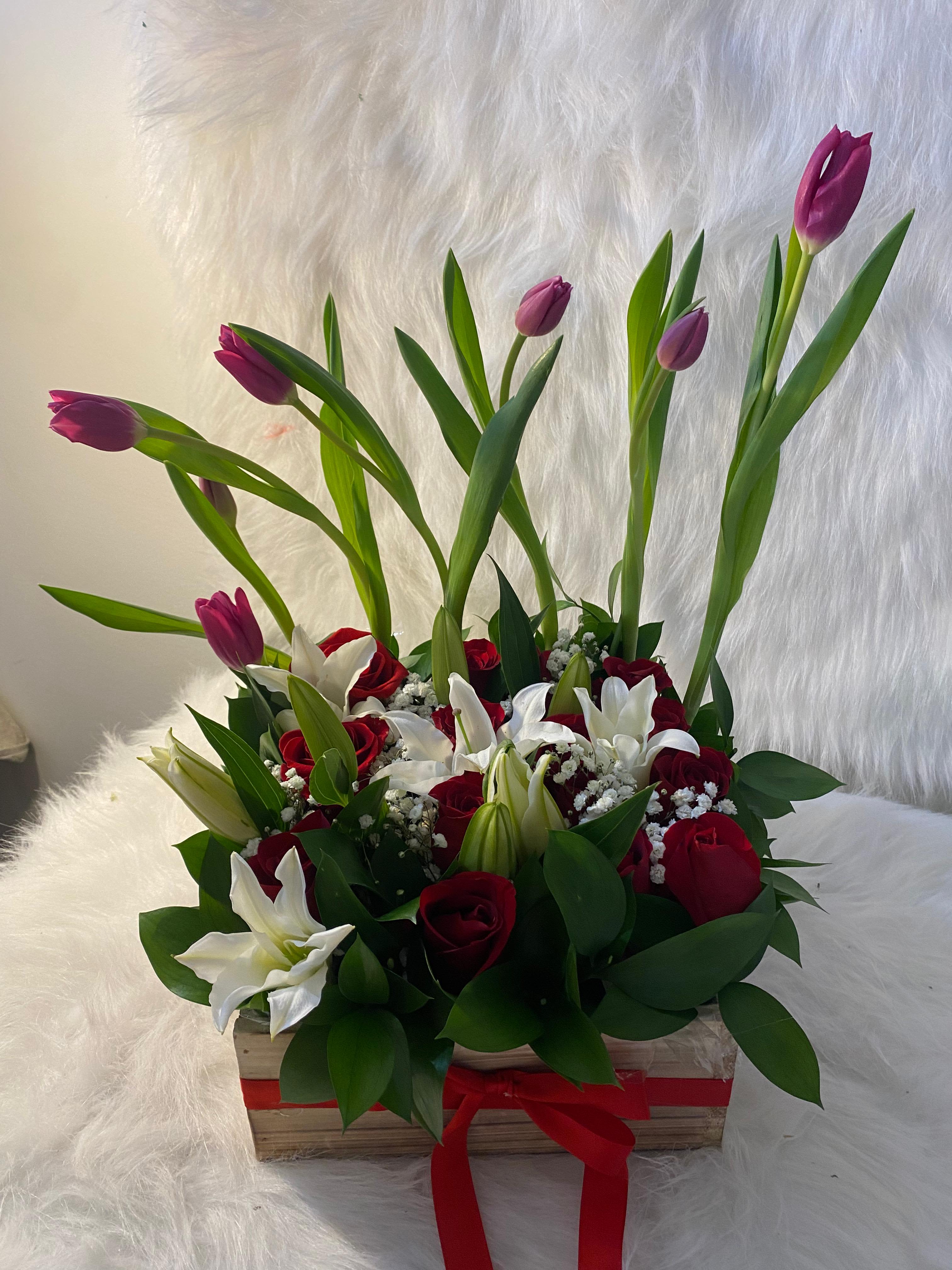 Garden tulips and roses  - A beautiful garden of tulips, lilies, baby's breath, and red roses. A simple yet elegant arrangement.