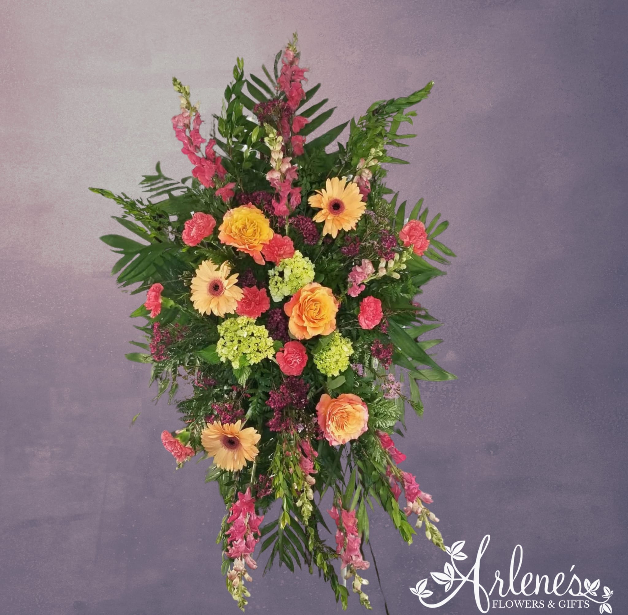 Peaceful Peach - Let our designers choose what is fresh and inspiring to honor your dearly departed. Feel free to give is a call if you would like us to customize it for you!