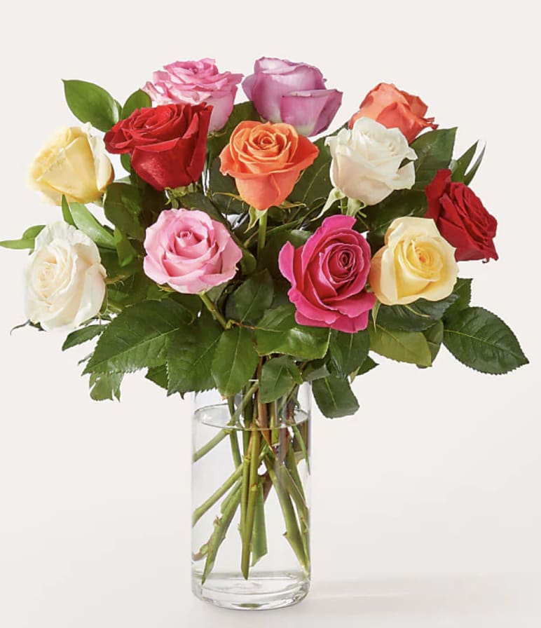 Mix Roses Bouquet - Colorful and entrancing, this bright bouquet of multicolored roses is an instant mood booster. An abundance of the freshest stems paired with touches of lush greenery to delight everyone from your special someone to your best friend for any occasion or sentiment.  Standard is Half a Dozen Mix Colored Roses Deluxe is a Dozen Mix Colored Roses
