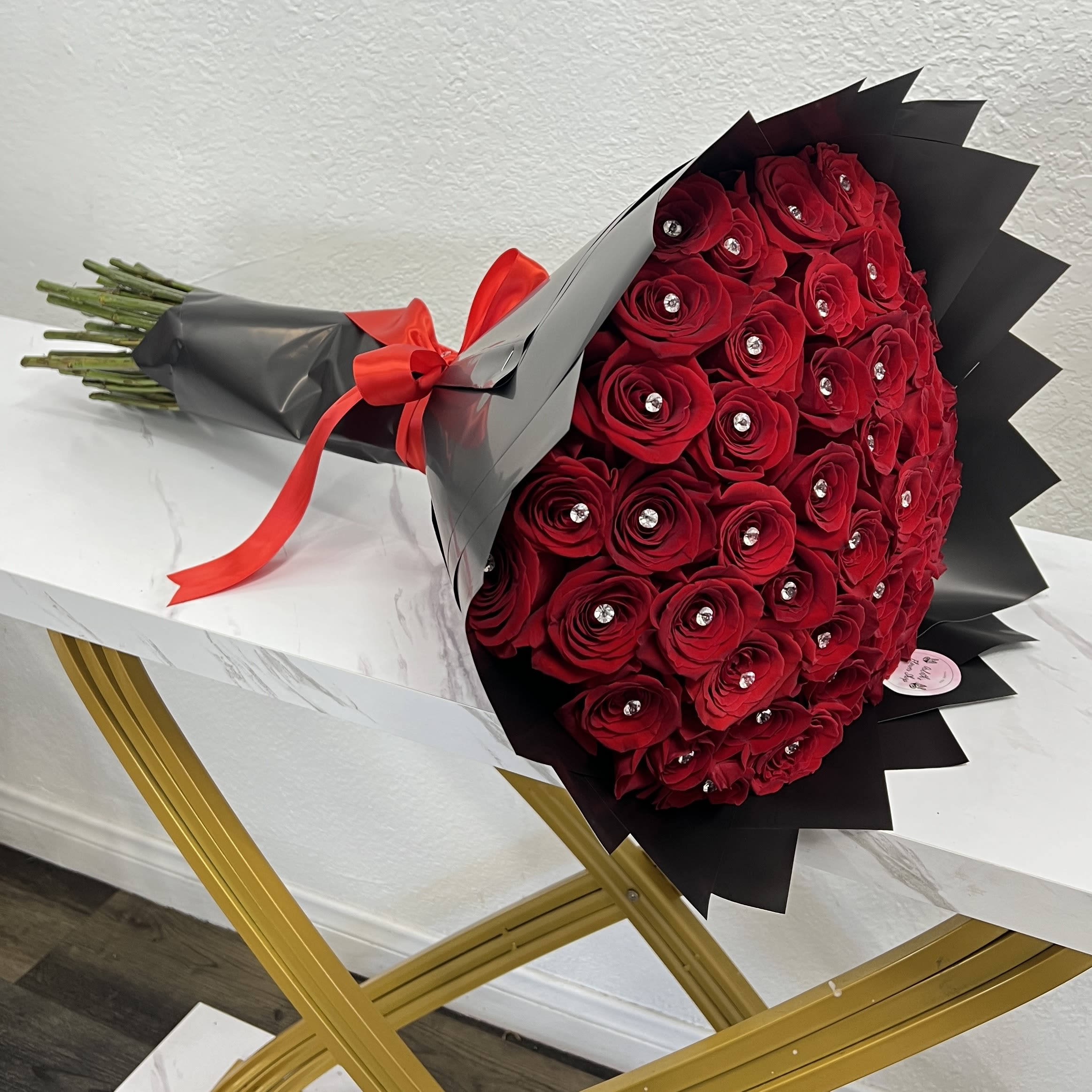 50 Red Roses With Pins And Black Wrapping Paper - Buyer will receive 50 Red Roses With Pins And Black Wrapping Paper