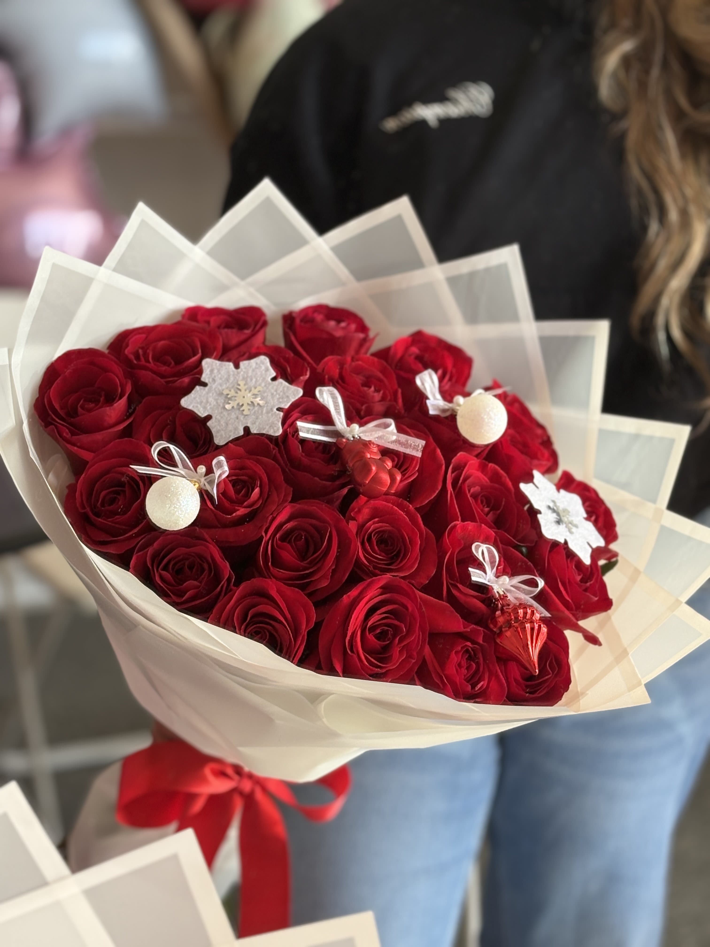 Holiday Bouquet - Two dozen red long-stem roses with adorable Christmas ornaments to spread holiday cheer.