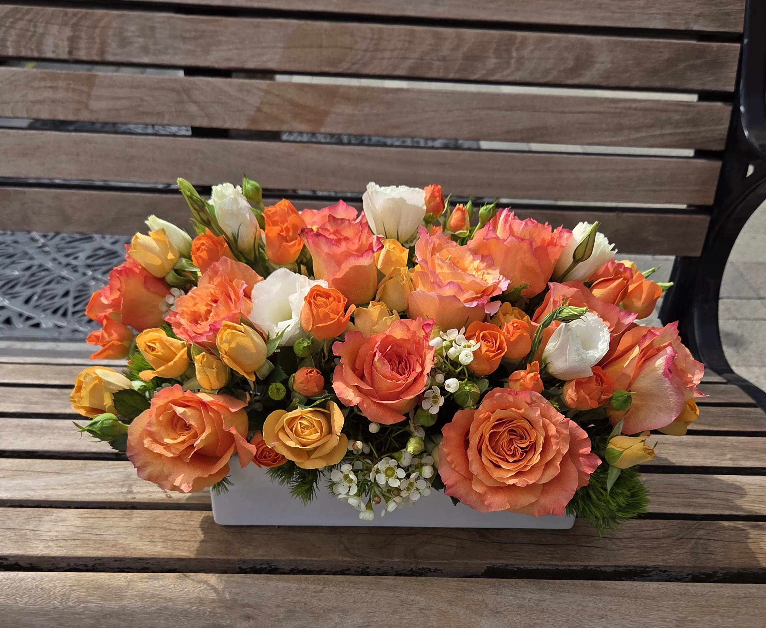 Tangerine  - This low profile, compact design is perfect for a special tablescape. Approximate finished size: 18"L x 10"W x 9"H