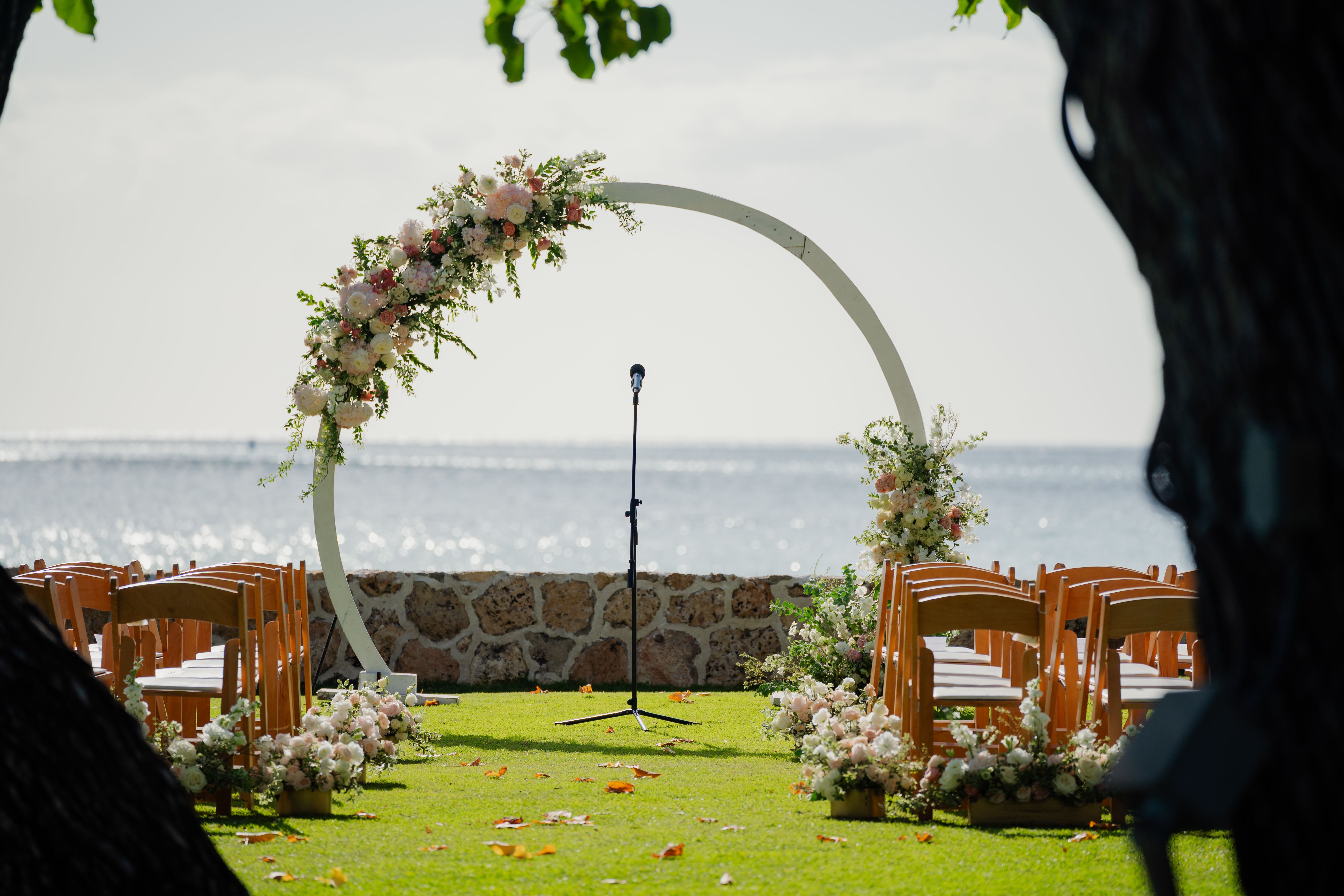 Enchanted Blush Arch - Soft, whimsical, and straight out of a fairytale — Enchanted Blush is a dreamy floral arch bursting with lush pink blooms and fresh green foliage. This magical combination creates a romantic and enchanting atmosphere, perfect for the wedding every little girl dreams of.  Whether framing a bridal aisle or creating a stunning ceremony backdrop, Enchanted Blush wraps the moment in tender charm and delicate beauty — a true celebration of love’s sweetest fantasy.