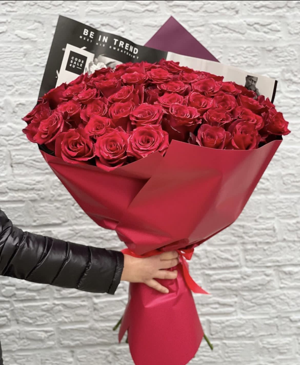50 red roses wrapped bouquet. The photo shows a standard size. - The photo shows a standard size.