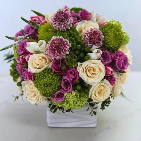Sunrise In Spring - Almost like a garden in springtime, this arrangement is for the trust flower lover.