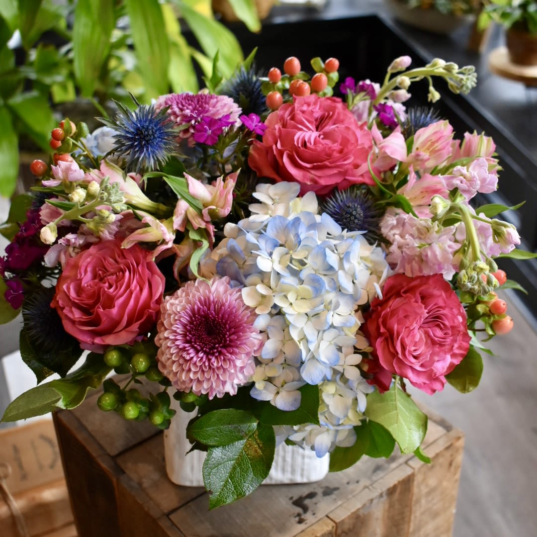 Country Garden - Each arrangement is custom designed, using seasonal, best-of-day blooms. The image shown represents its size, style and temperament, however certain flowers may be substituted to achieve the best quality and longevity for your florals.