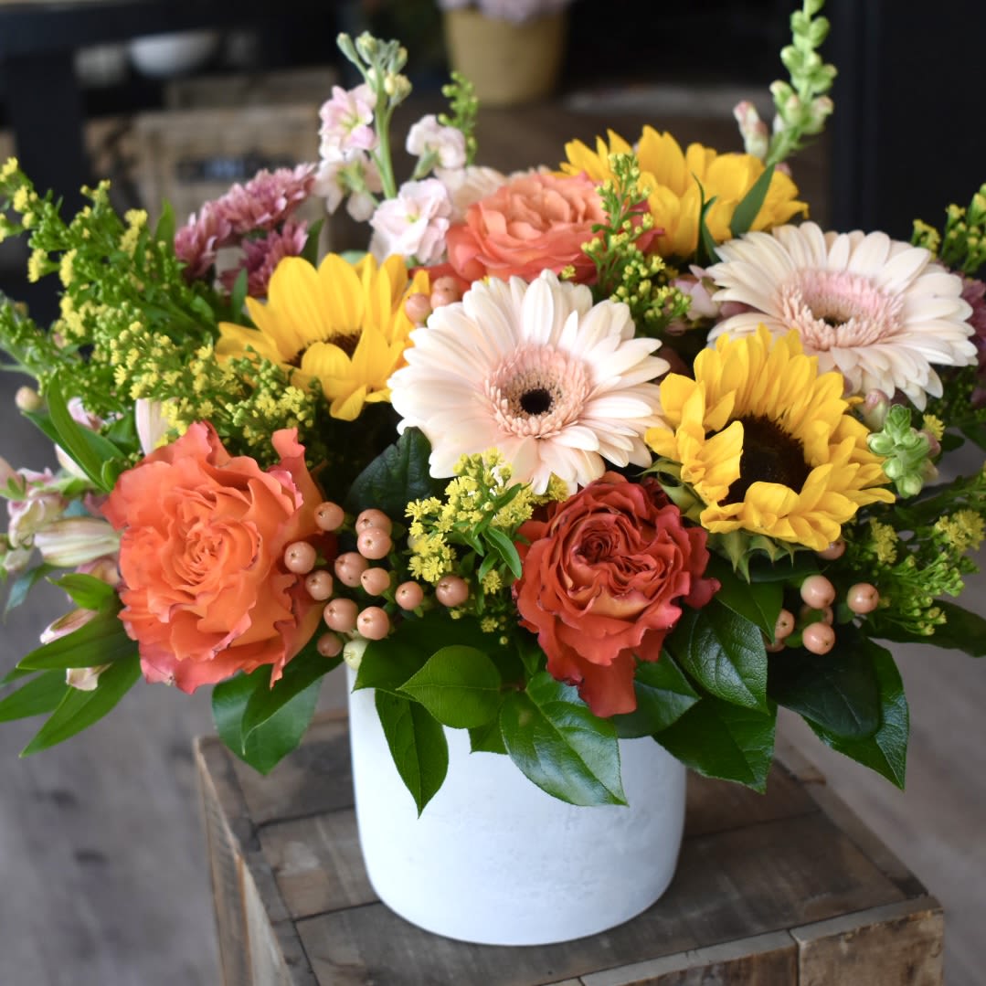 Here Comes The Sun - Each arrangement is custom designed, using seasonal, best-of-day blooms. The image shown represents its size, style and temperament, however certain flowers may be substituted to achieve the best quality and longevity for your florals.