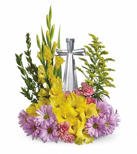 Yellow and lavender floral arrangement with a silver cross centerpiece