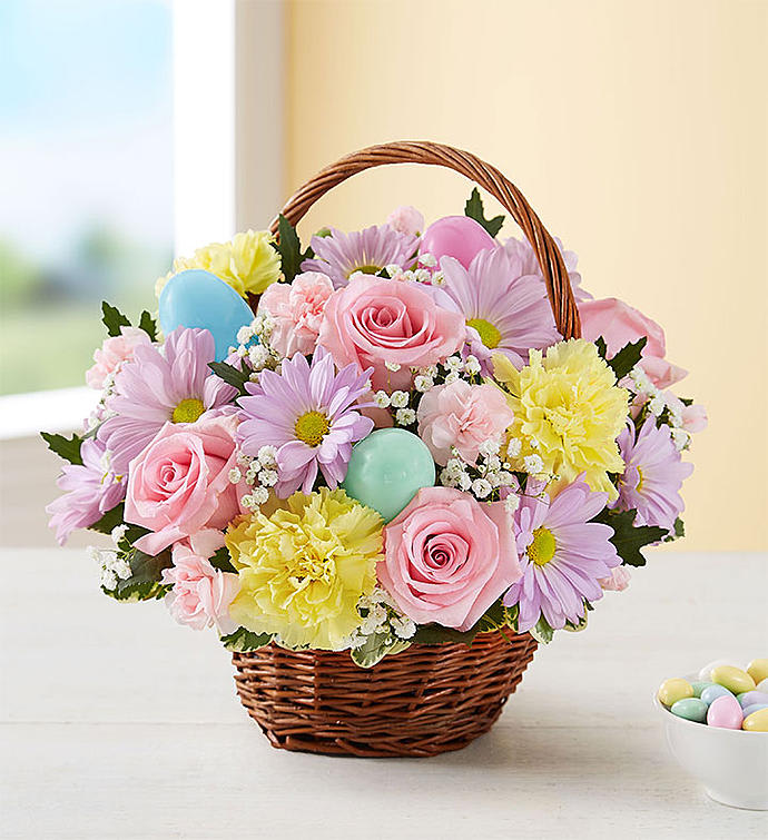Easter Flower Basket - Send our delightful Easter Basket bouquet, and they’ll carry your thoughtfulness with them through the holiday and beyond. We’ve gathered our freshest blooms in pastel shades of pink, yellow, and lavender inside a charming rustic basket with colorful Easter eggs for a truly festive surprise. Makes an especially lovely gift for the holiday host!