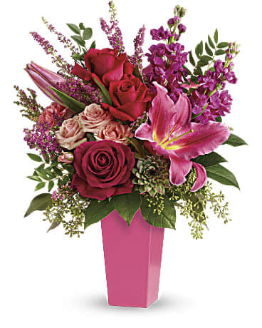 Forever Fuchsia Bouquet - Pretty in pink! A surprise they'll remember forever this fantasy of fuchsia lilies roses and carnations is artistically arranged in a sleek contemporary vase. Pink colored vase used upon availability in shop. Vases are out of stock. Will need to use a clear vase.
