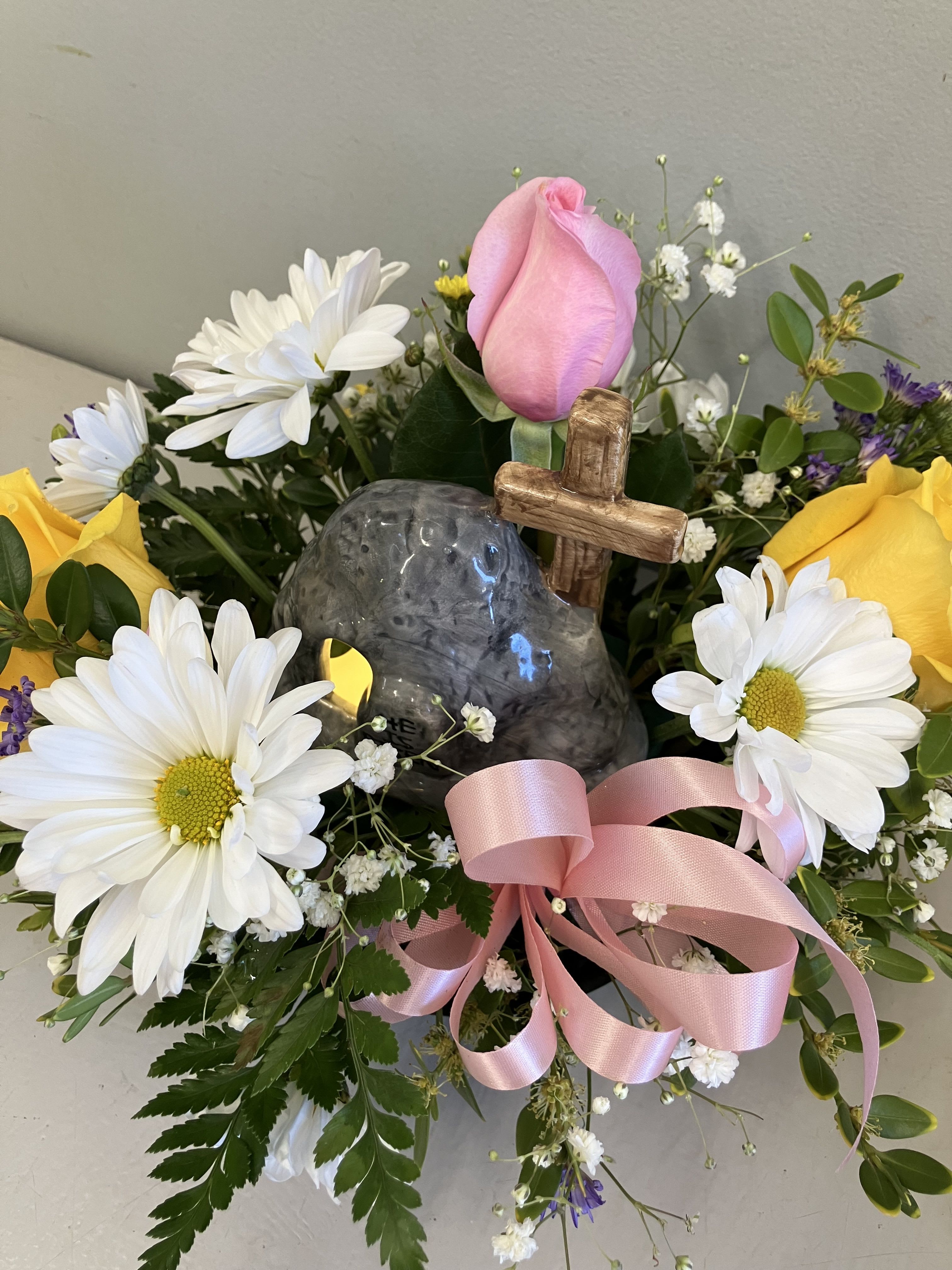 He Is Risen Centerpiece  - Floral centerpiece for your Easter dinner, pretty spring colored flowers surround a ceramic light that says “He is risen”
