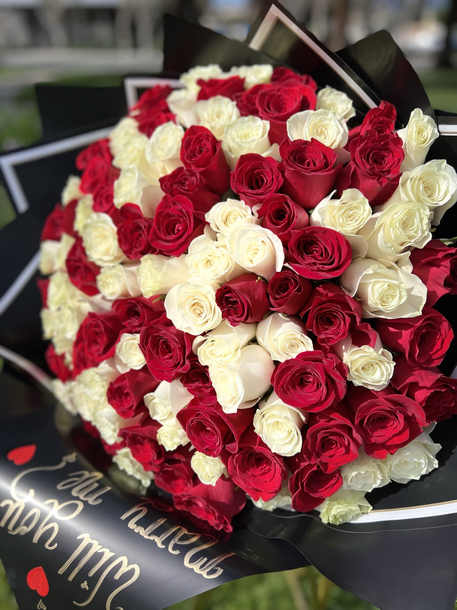   100 White and Red Roses - 50 Red and  50 White Roses Bouquet, Black Paper Wrapped.