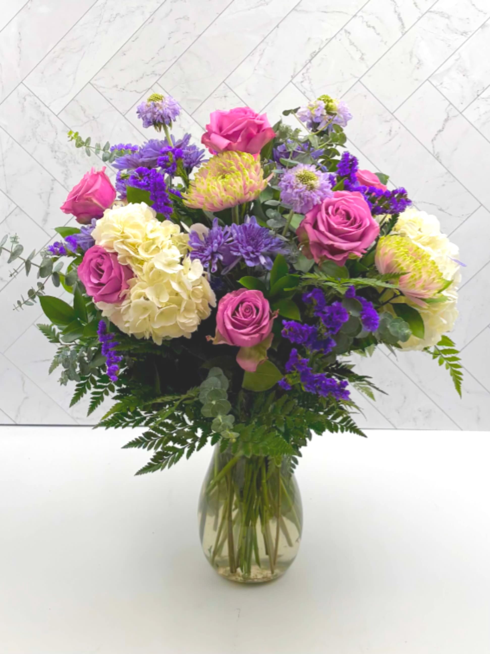 MOMS GARDEN - Moms garden is a mix of hydrangeas, roses, scabiosa, cremons, and more.