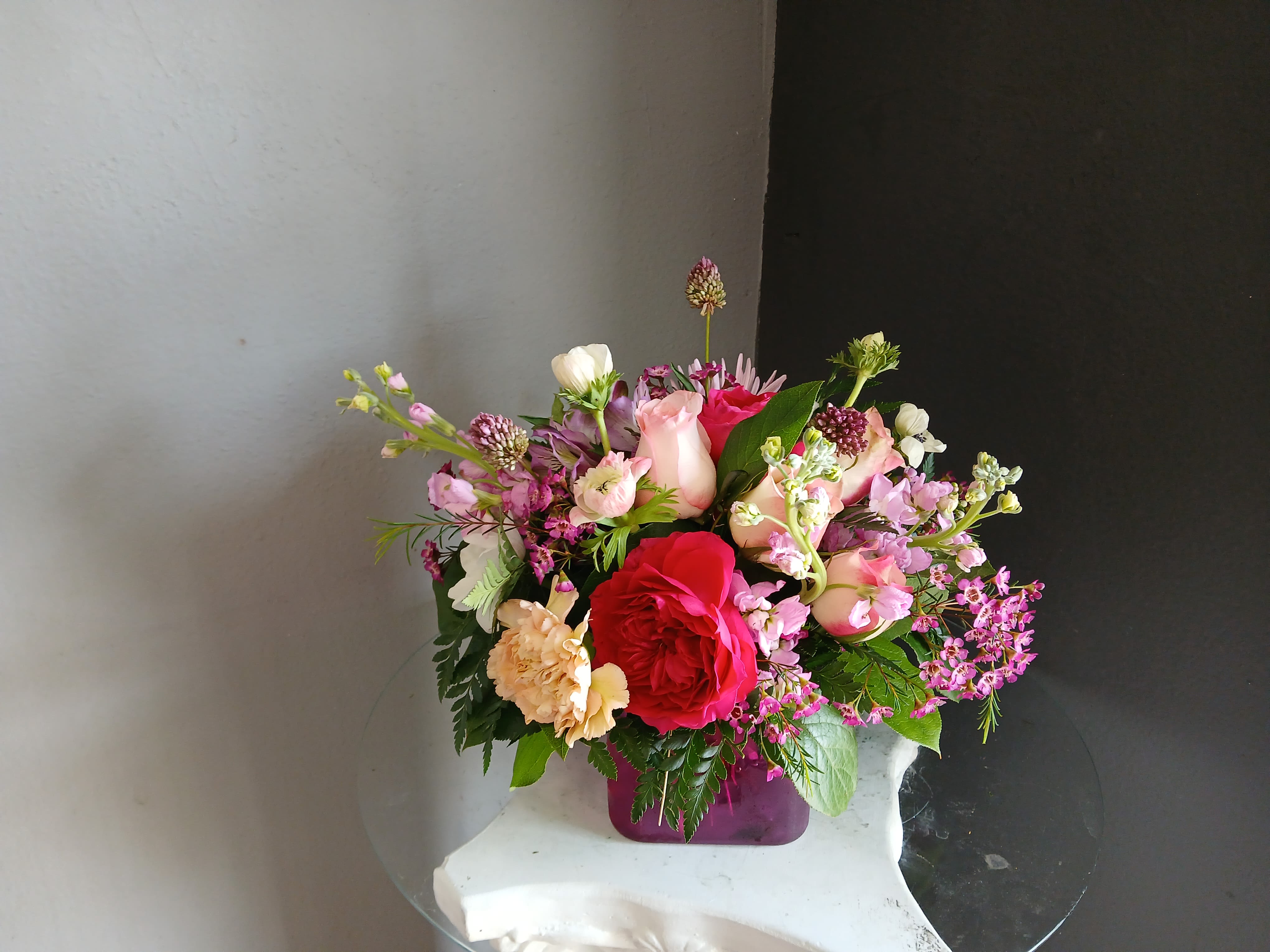 #711 Designer's Choice Vase Arrangement  - This beautiful flower arrangement of fresh mixed seasonal blooms is made by local designers in the heart Orange California. Hand crafted and perfect for every occasion, from birthdays and new babies to sympathy and just because. The best choice to show you are thinking of that special someone. Can be sent as a local delivery or in-store pickup. This is an original, one of a kind arrangement. Order now before it's too late!