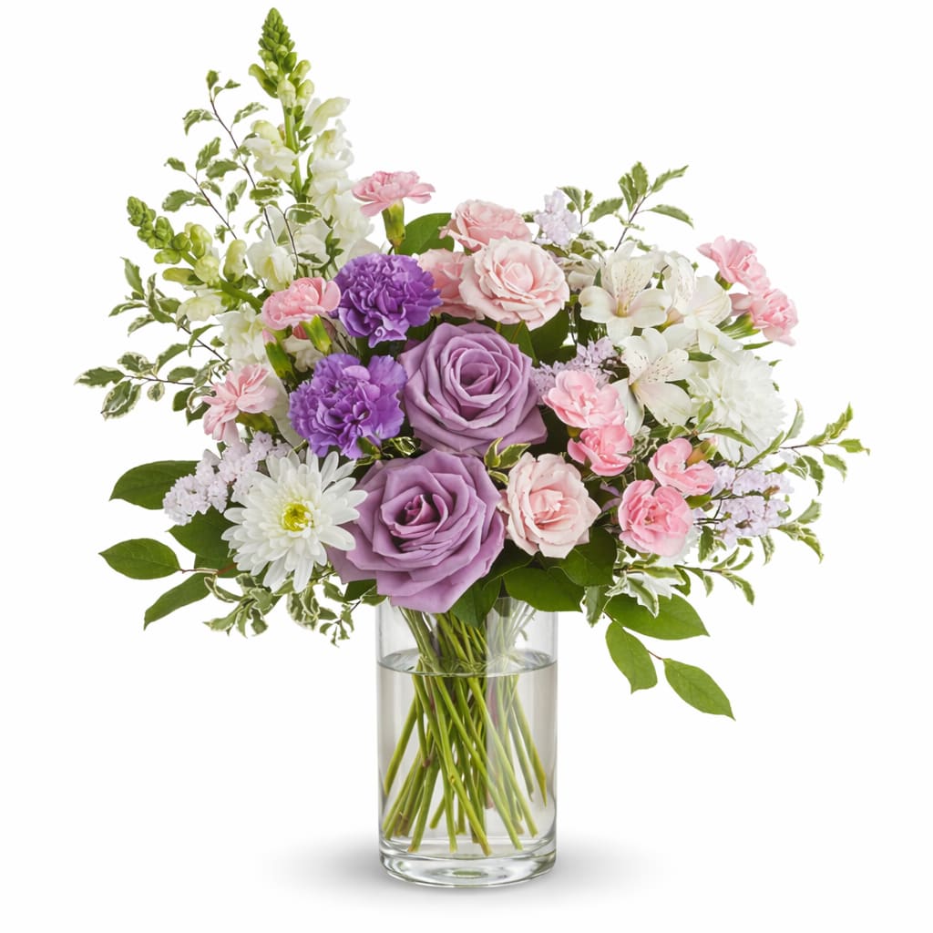 Sincerest Love Bouquet - This lush, bountiful bouquet of pink and purple blooms features an elegant mix of roses, and other blooms hand-designed inside a classic clear glass vase. 
