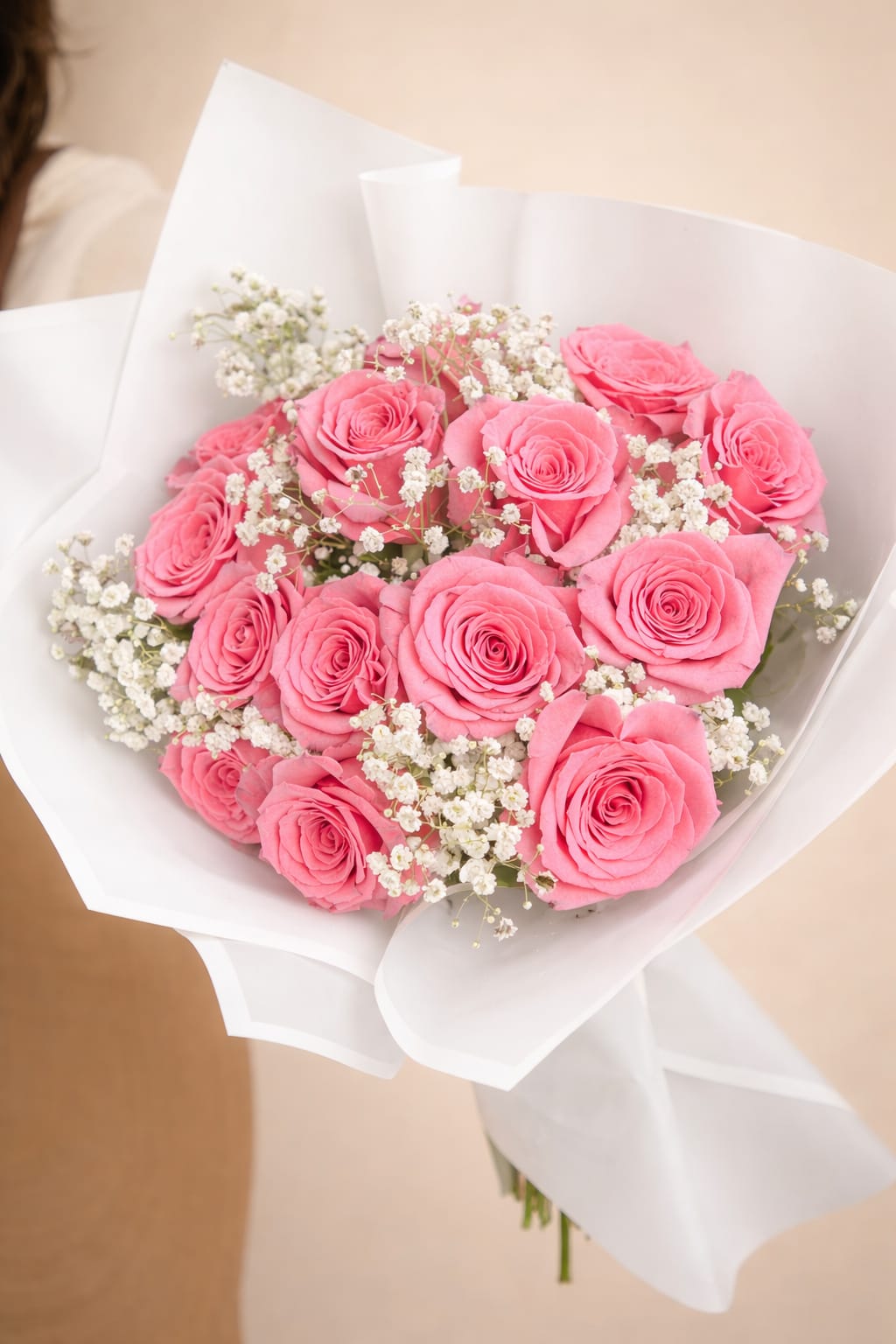 MOULIN BLUSH BOUQU - Striking bouquet featuring 12 premium red roses, imported from Ecuador, wrapped in White and pink  Korean paper and delicately accented with baby’s breath.