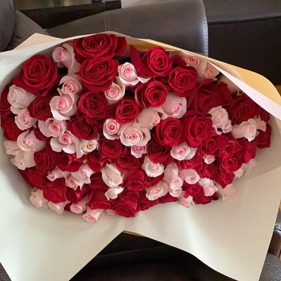 Bicolor Bouquet 100 - 100 Beautiful Bicolor Bouquet, with 50 Red Roses, and 50 Light Pink Roses, wrap with Pastel Color Paper, and Red or Pink Ribbon.