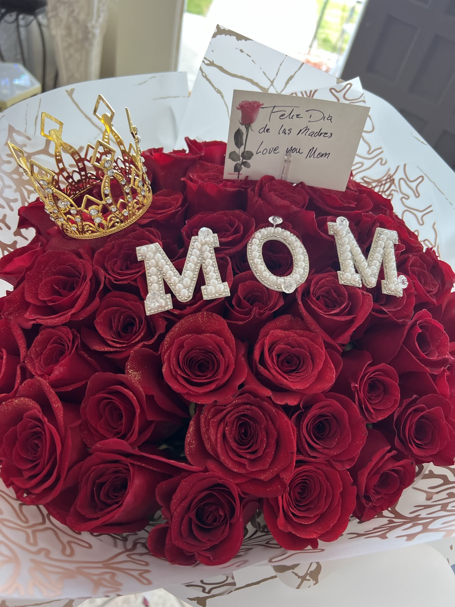 La Mami "Nice" Roses - Bouquet of Red Roses with the letters M O M is included and a 2-inch wreath.