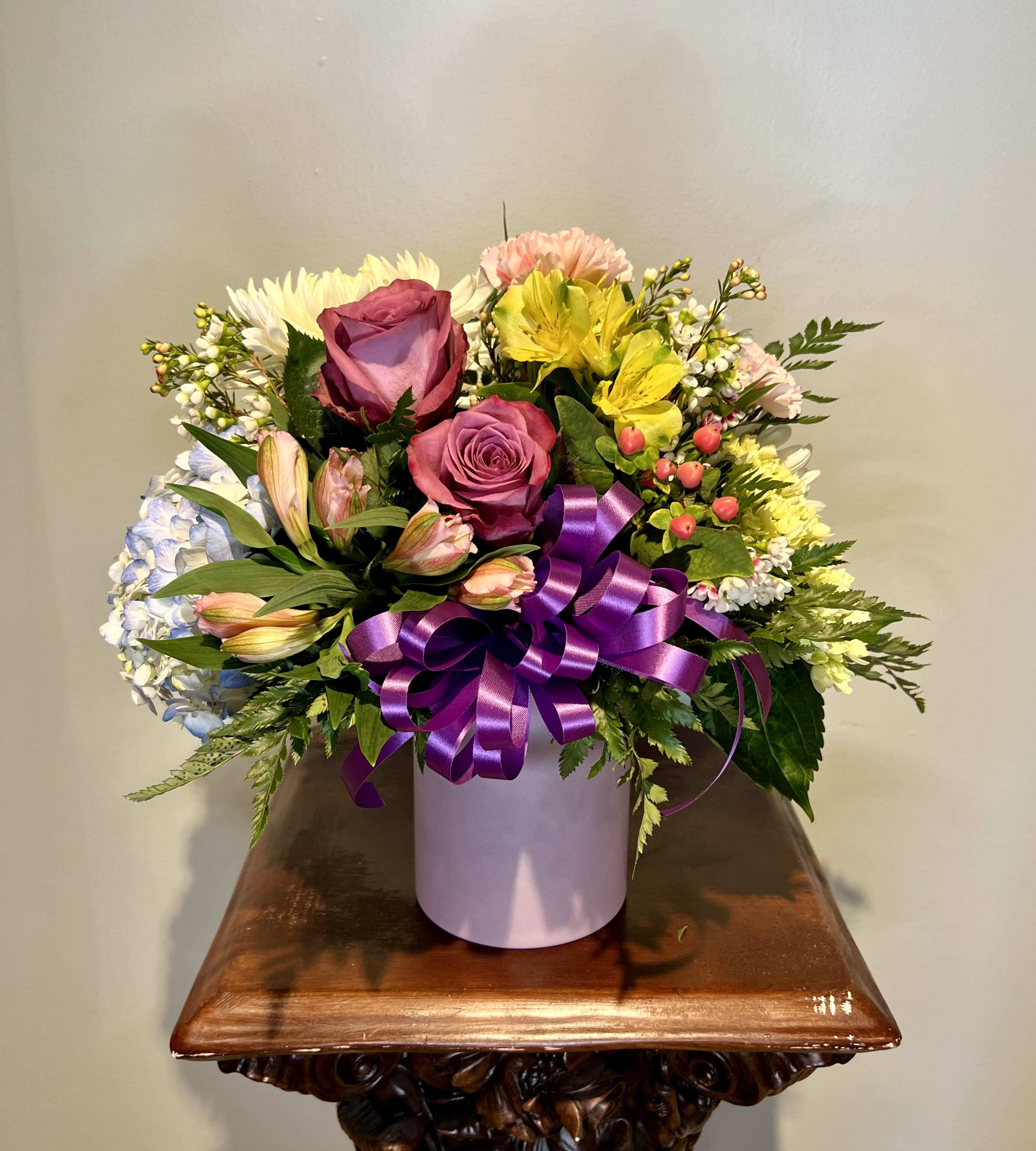 You are Amazing -  Bright and colorful spring blooms fill this pink vase and makes a great gift to show them how much you care.  Flowers and container may be adjusted depending on product availability. 
