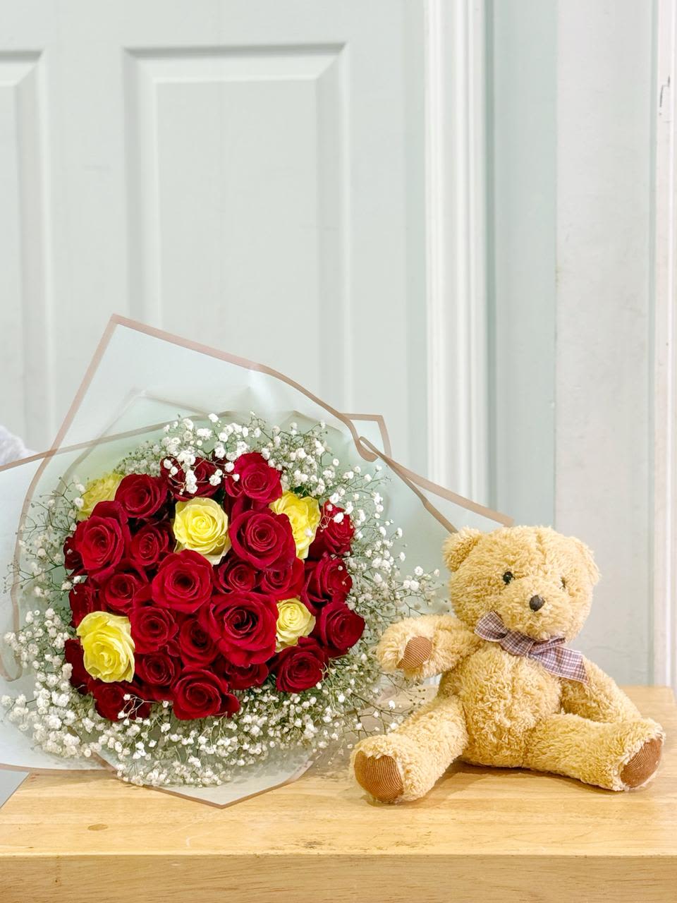 BEAR AND ROSES - 2 DOZEN ROSES , ADORENED WITH BABY BREATH , in beautiful paper , with full size size bear  