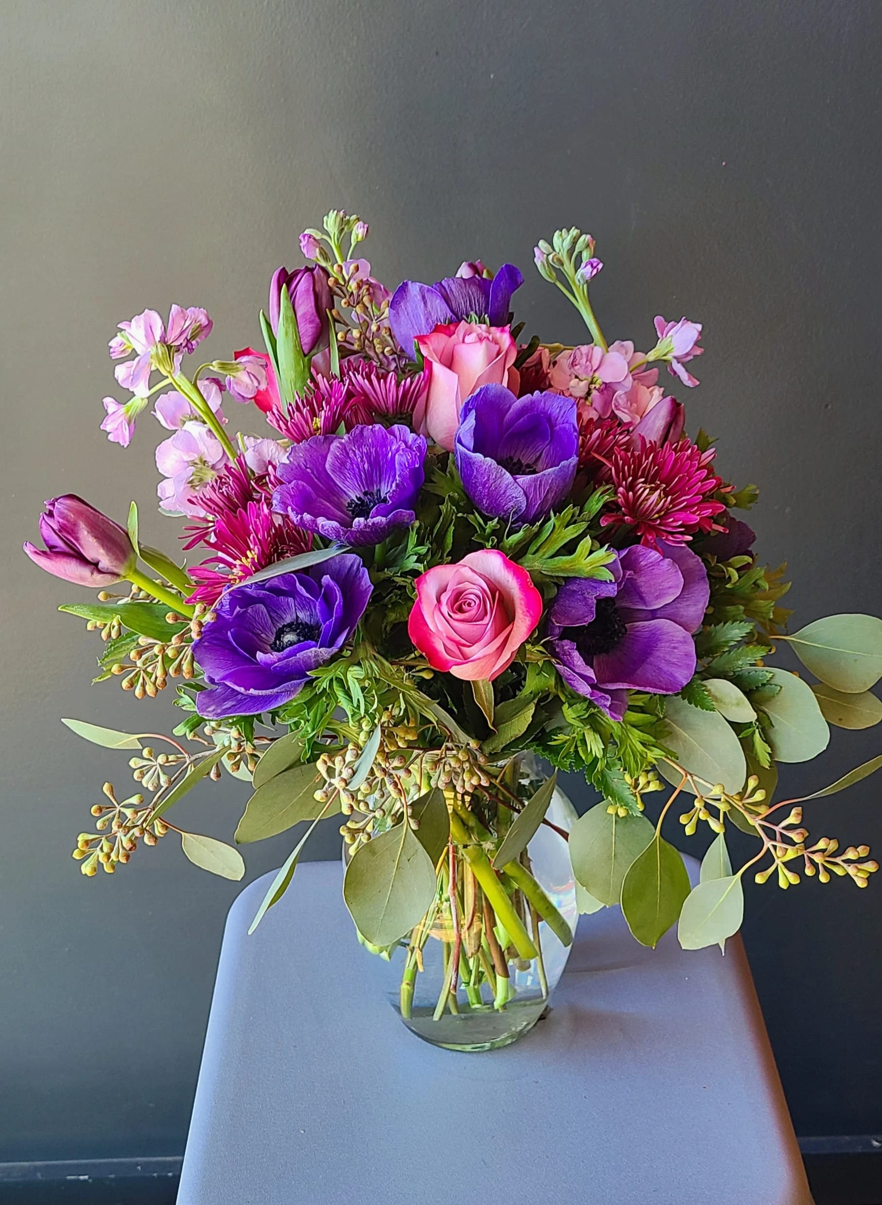 Midsummer Night - This relaxing arrangement of roses and anemone carries a feeling of cool midsummer nights.