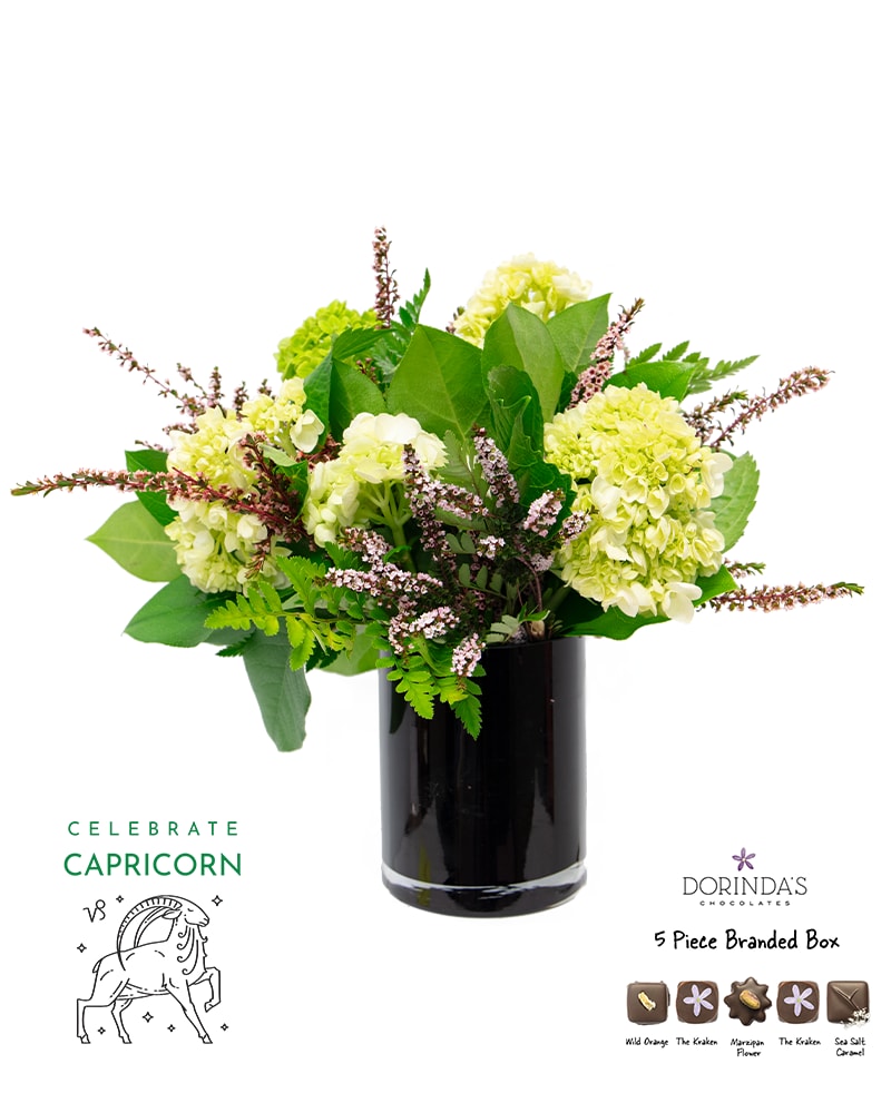 Capricorn Birthday Bundle - Celebrate your Capricorn with this perfectly curated birthday bundle! Each set includes a beautifully arranged small vase with flowers that corresponds to each zodiac's birth flower, a personalized Capricorn horoscope card, and a 5-piece assortment of indulgent Dorinda's truffles.