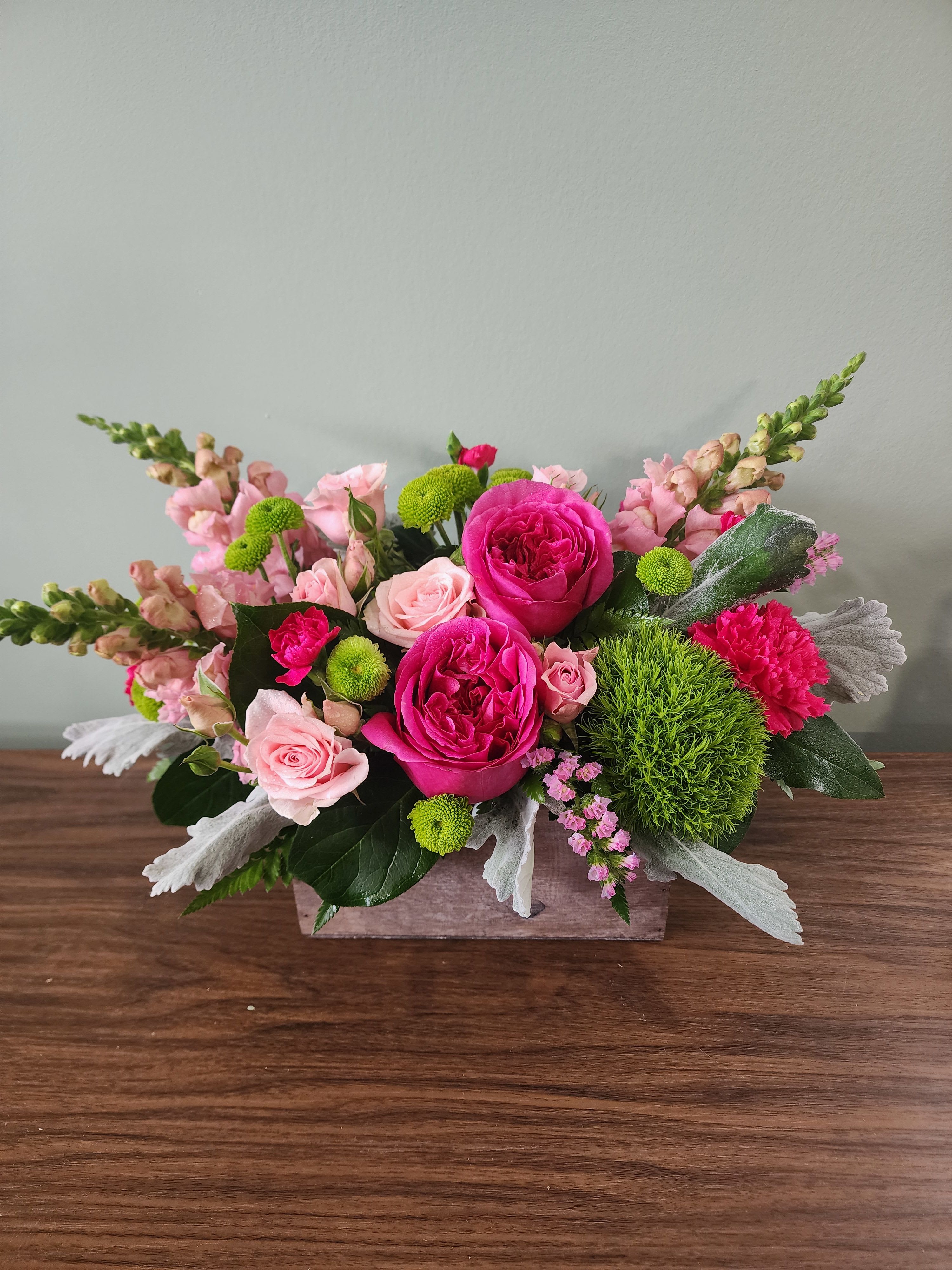  Garden Delights by MG Florist  - Put a smile on her face and a spring in her step with this delightful little garden bouquet. Presented in a chic bamboo box, its happy hot pinks and lovely lime greens give a colorful pick-me-up! 