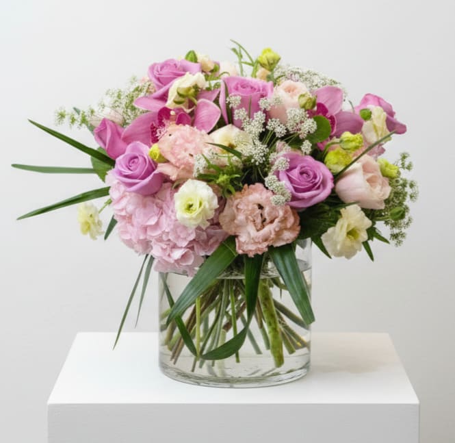 Elevated brunch - This design is in a large glass cylinder vase, and is 16-18" wide x 10-12" high.