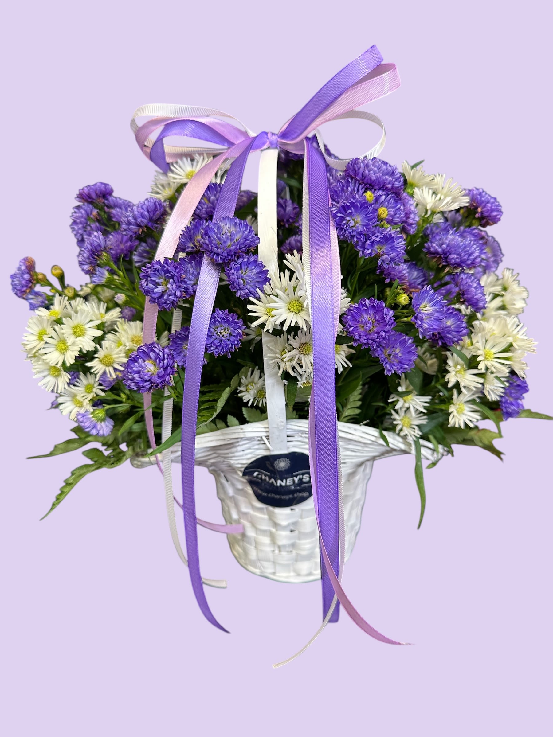 Chaney‘s spring basket 1001 - Purple and white fresh cut flowers in a white basket