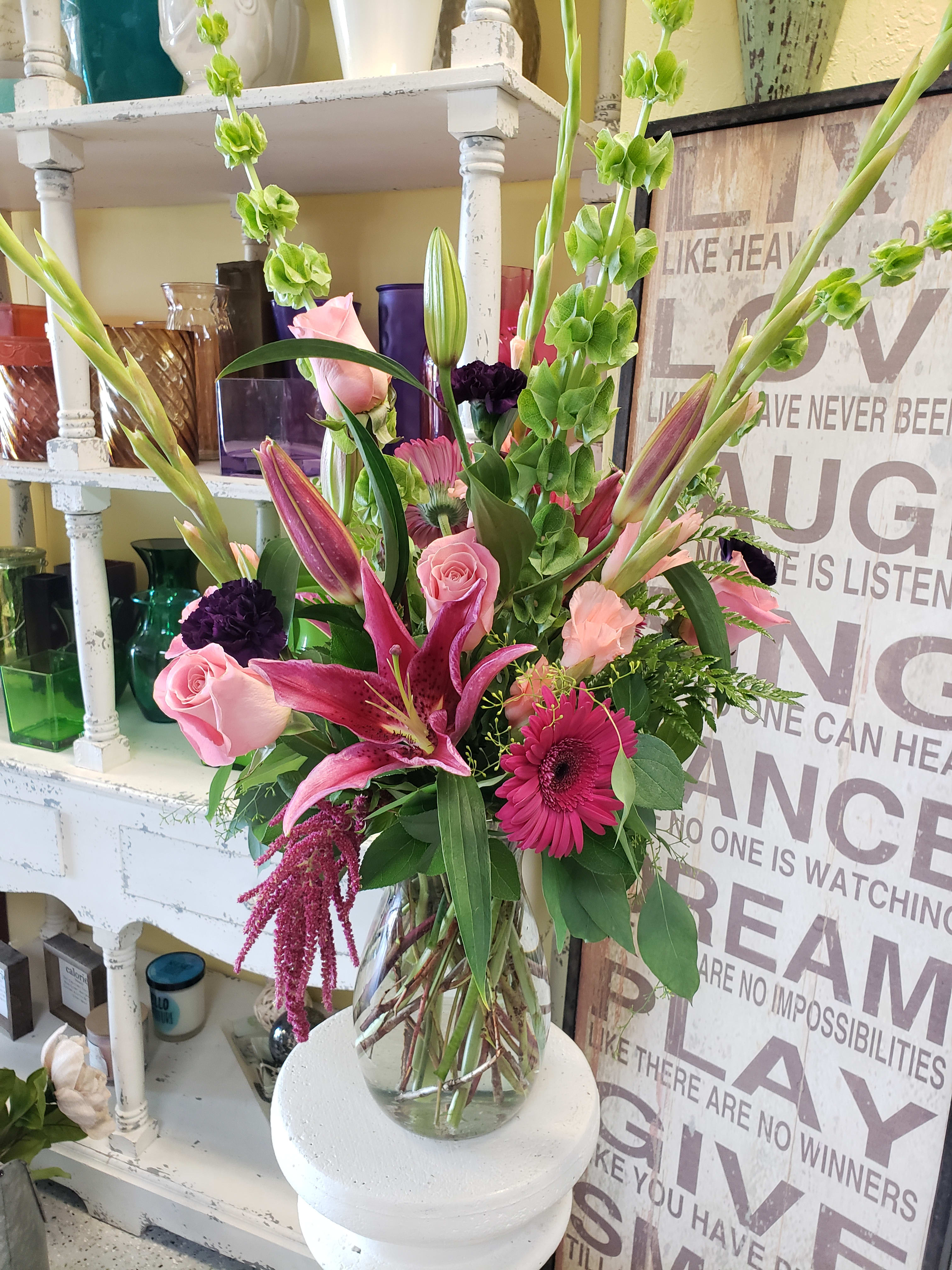 Evening Bliss - Beautiful display of elongated floral mix displaying deep pinks and purples perfect for any romantic evening/ occasion.  premium picture shown