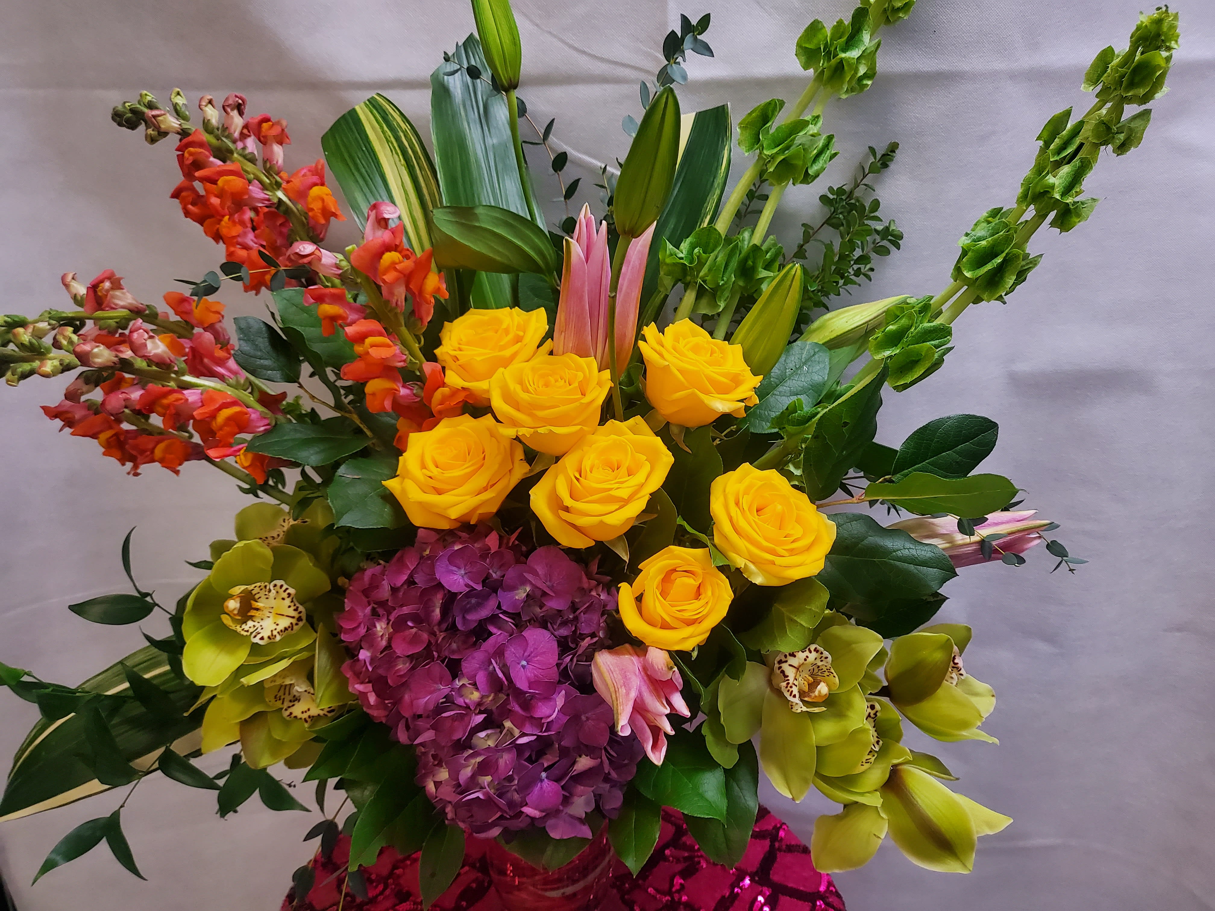 Perfect for paradise - Assortment of big yellows and tons of greenery for a tropical bouquet any day! Yellow roses, Hydrangeas &amp; Lilies. Premium version is pictured.
